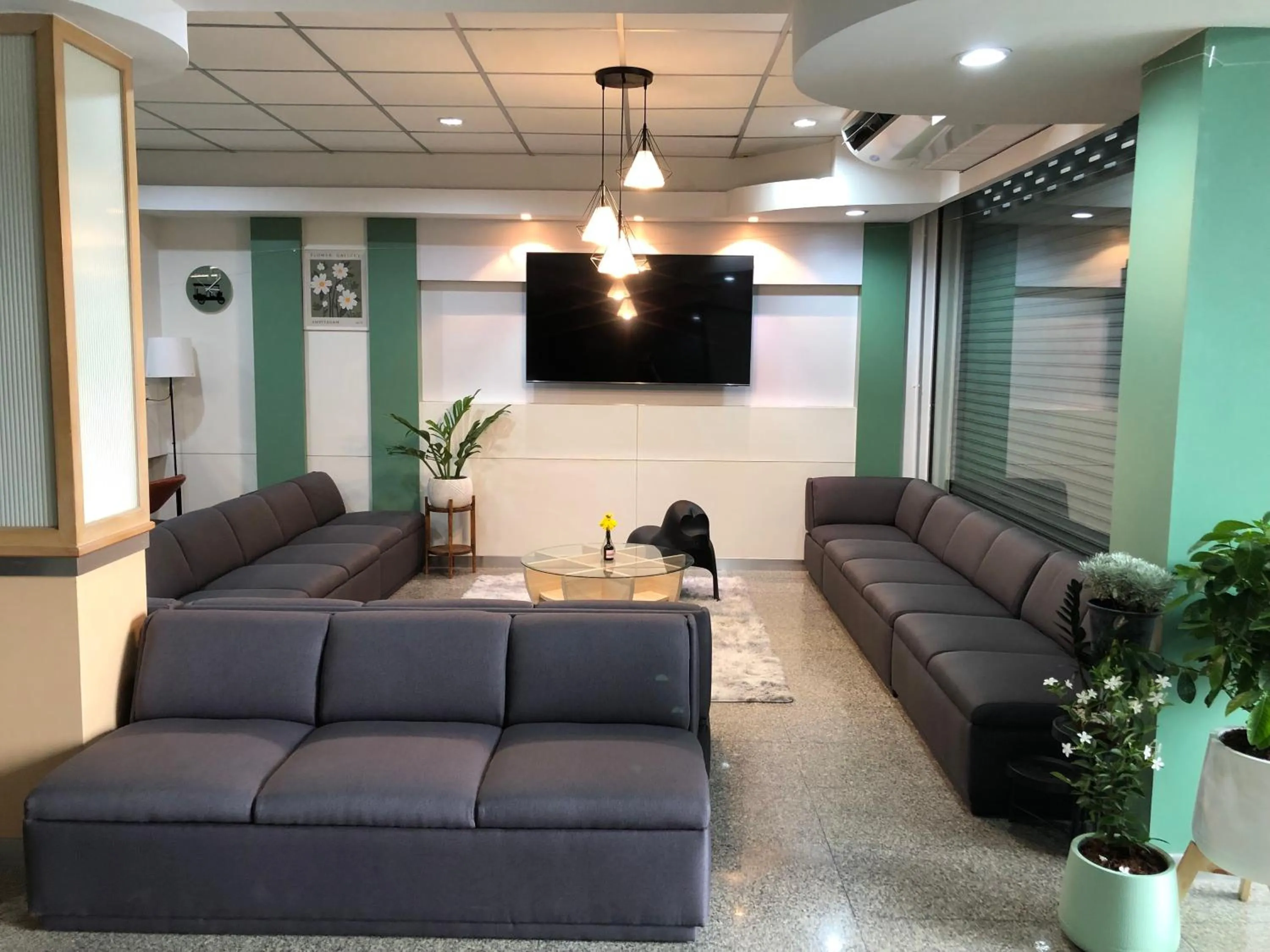 Communal lounge/ TV room in Marni BKK Hostel