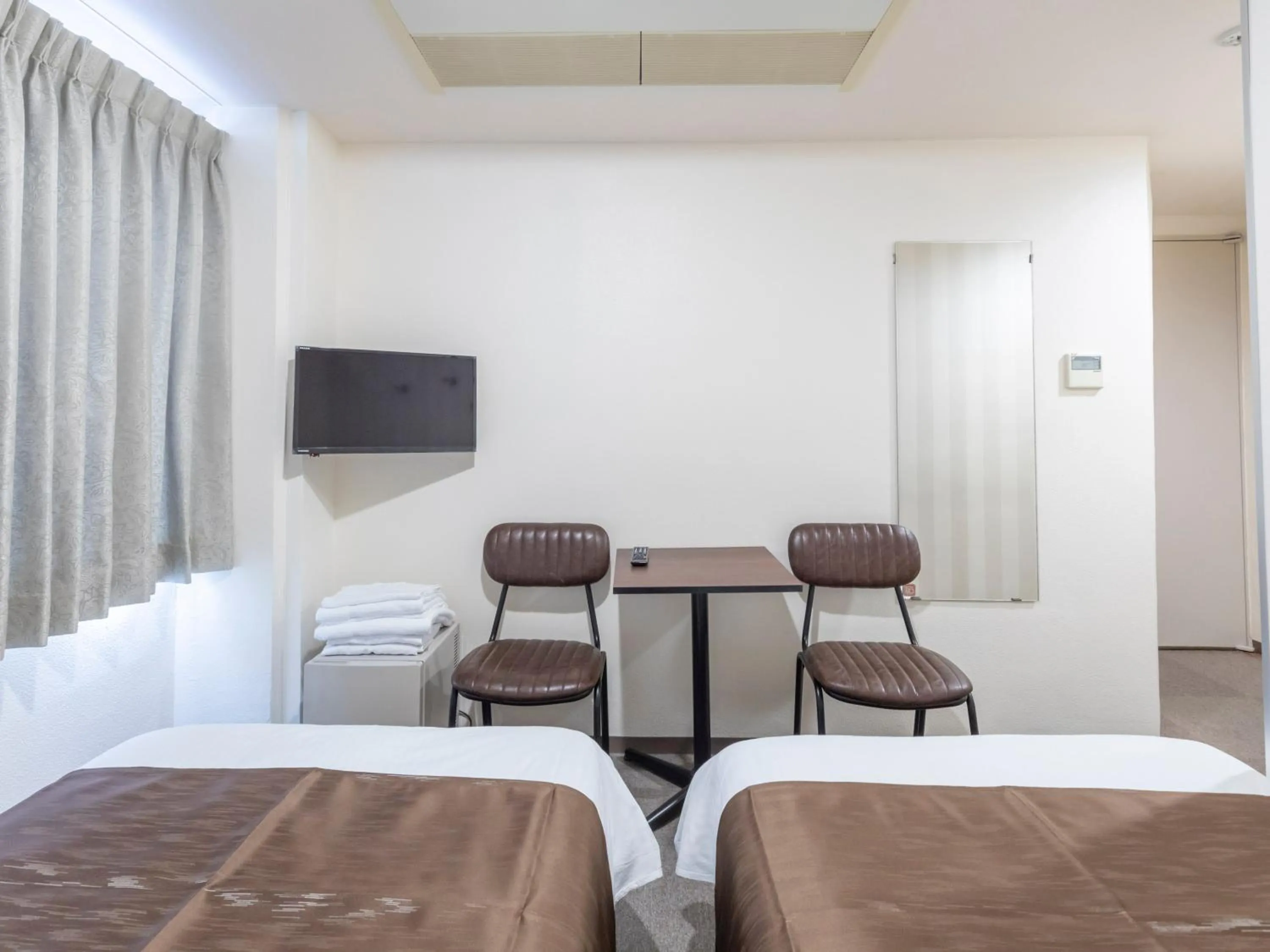 Photo of the whole room, Bed in Tabist New Gekkoen