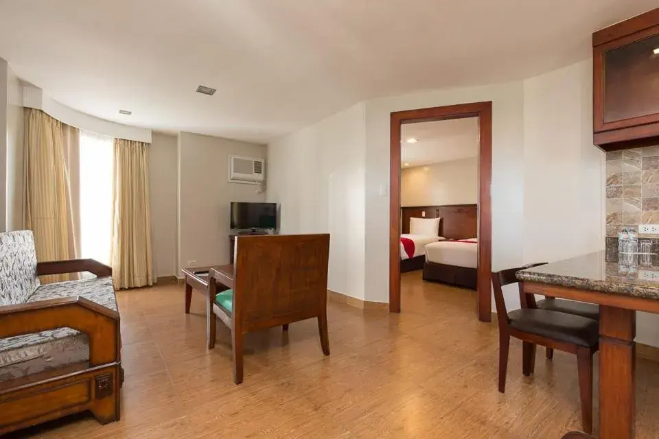 Living room, Bed in MJ Hotel and Suites Living room, Bed in MJ Hotel and Suites