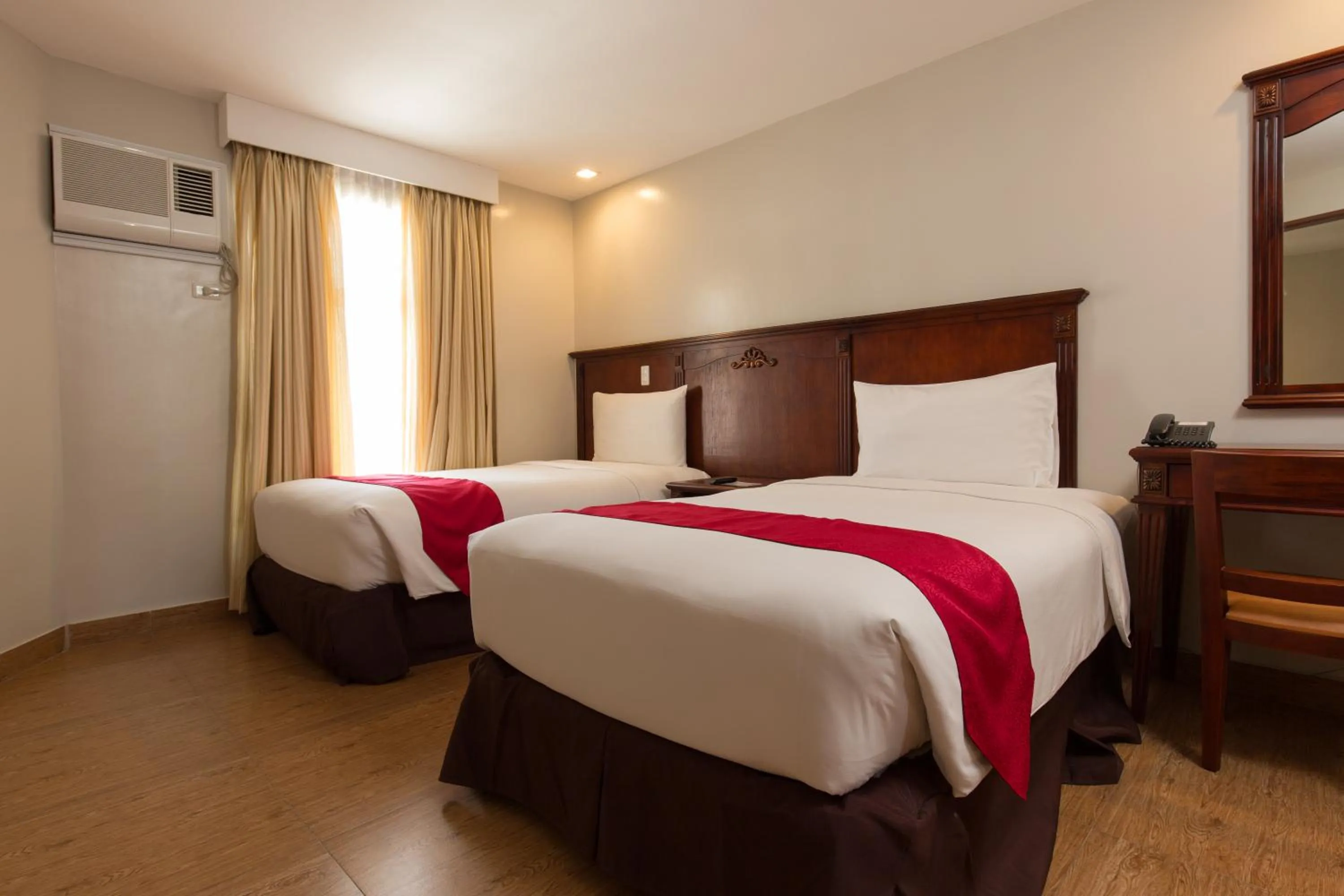 Bed in MJ Hotel and Suites