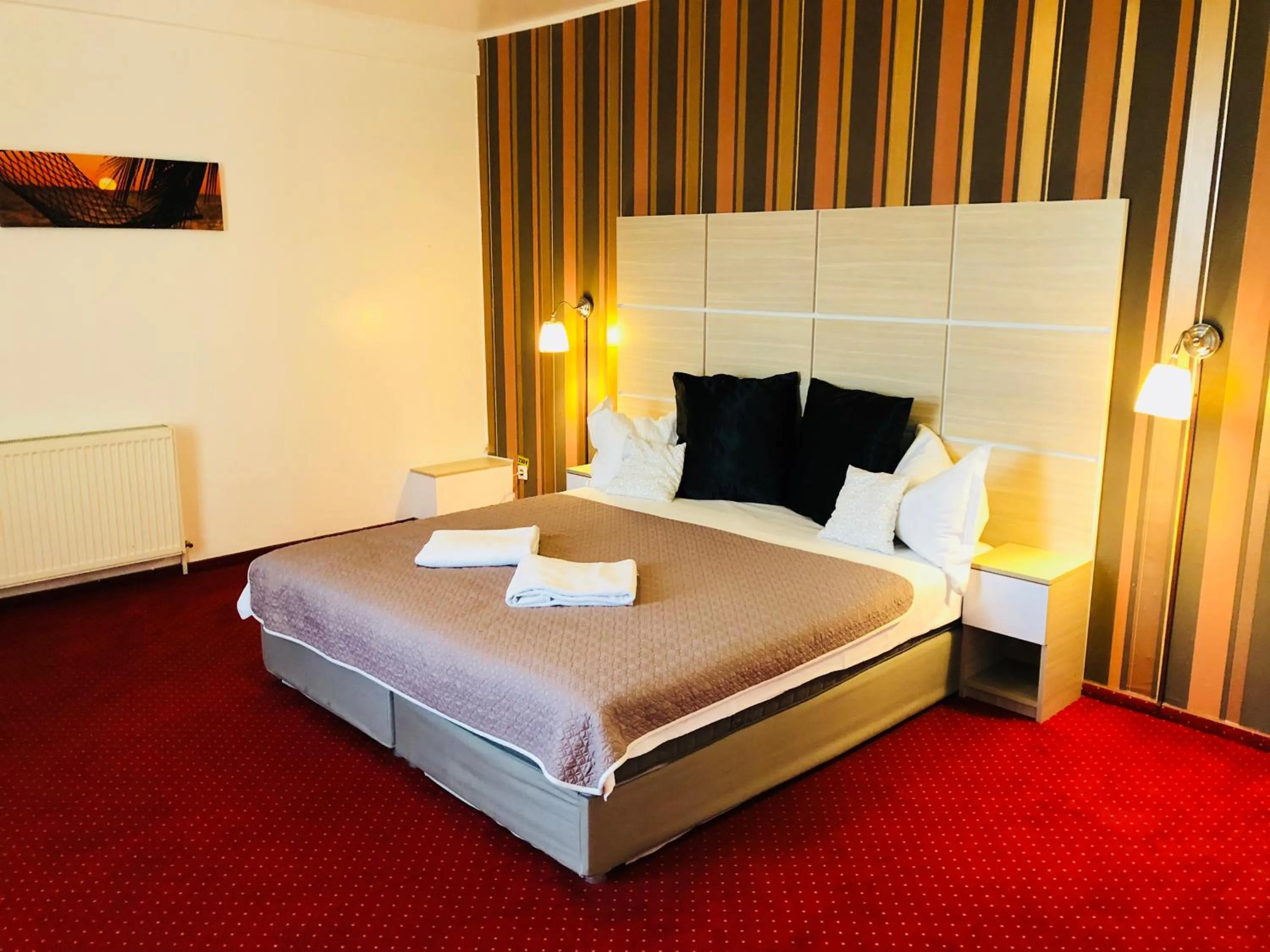 Bed in Hotel Mon Caprice