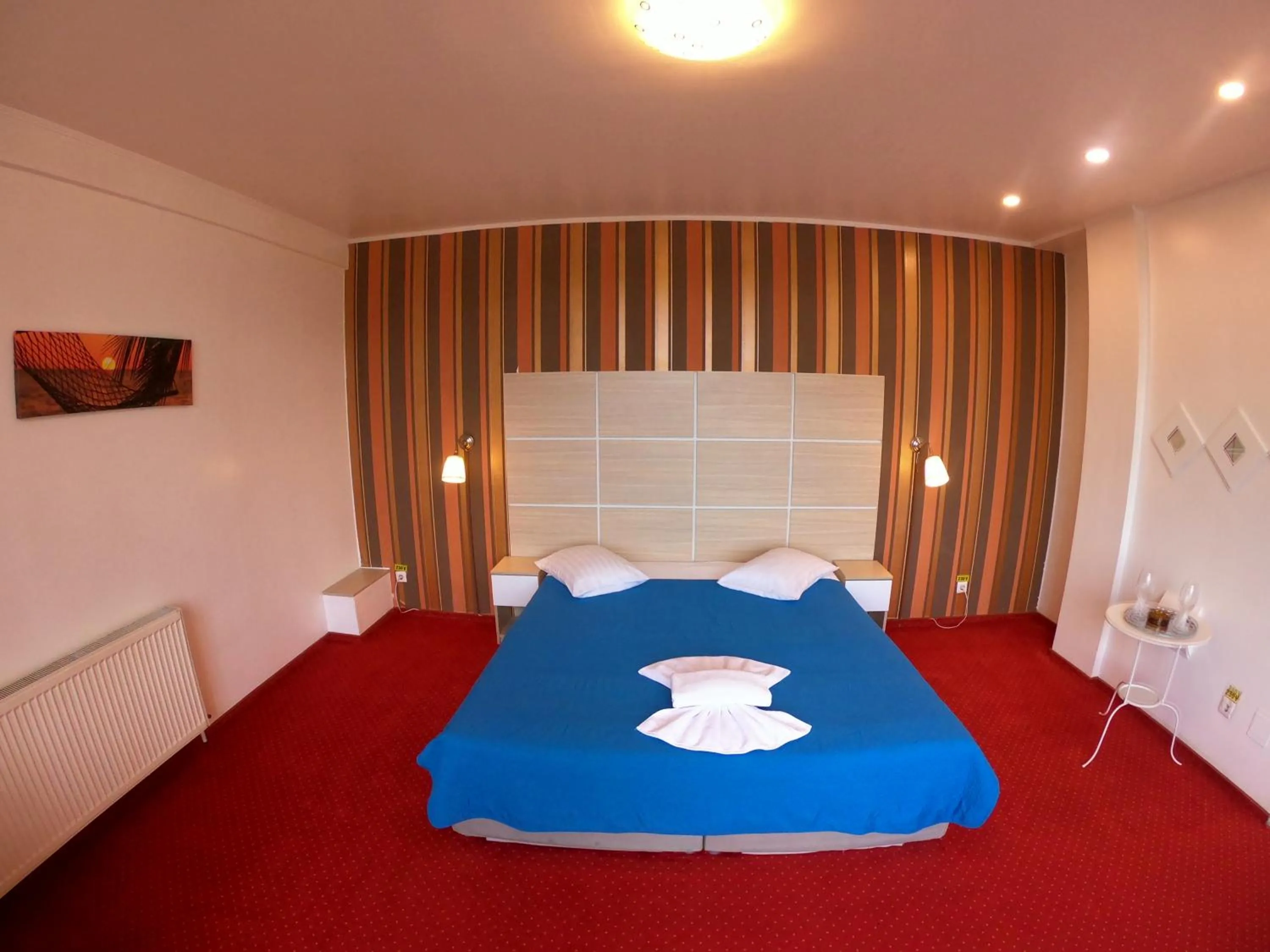 Bed in Hotel Mon Caprice