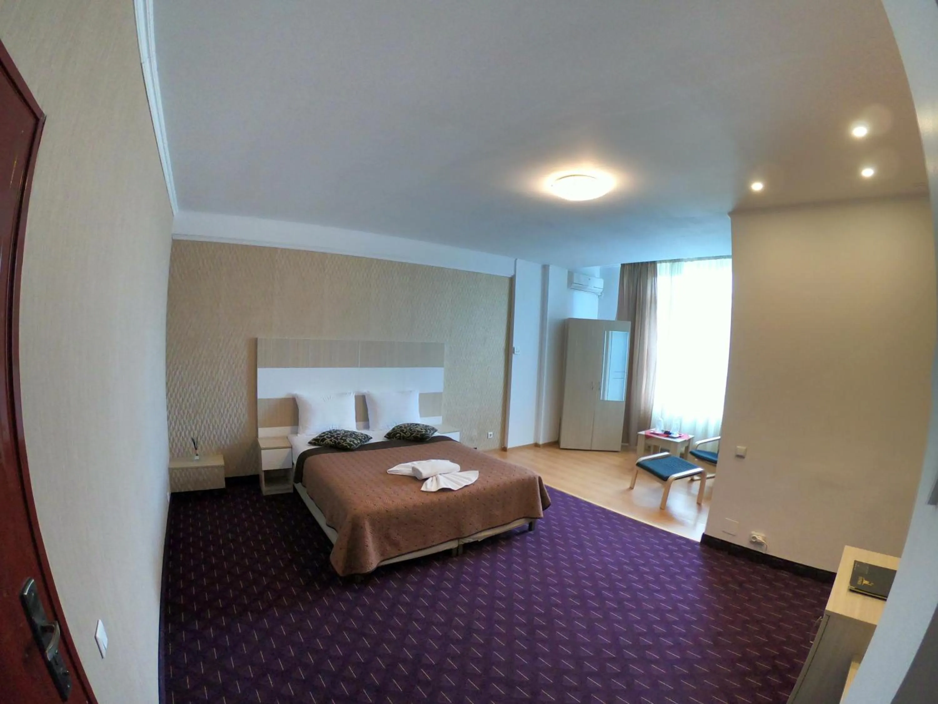 Bed in Hotel Mon Caprice