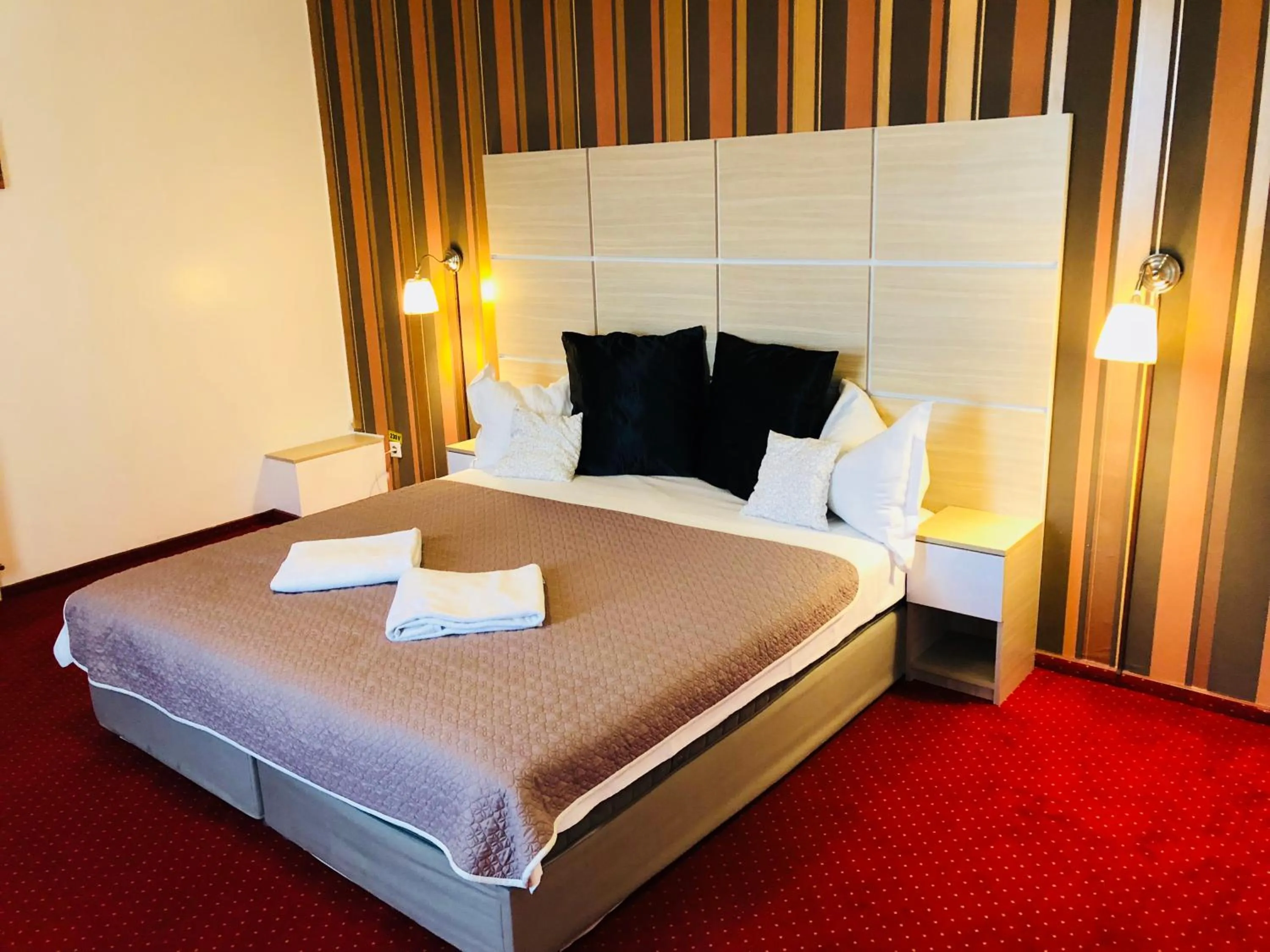 Bed in Hotel Mon Caprice