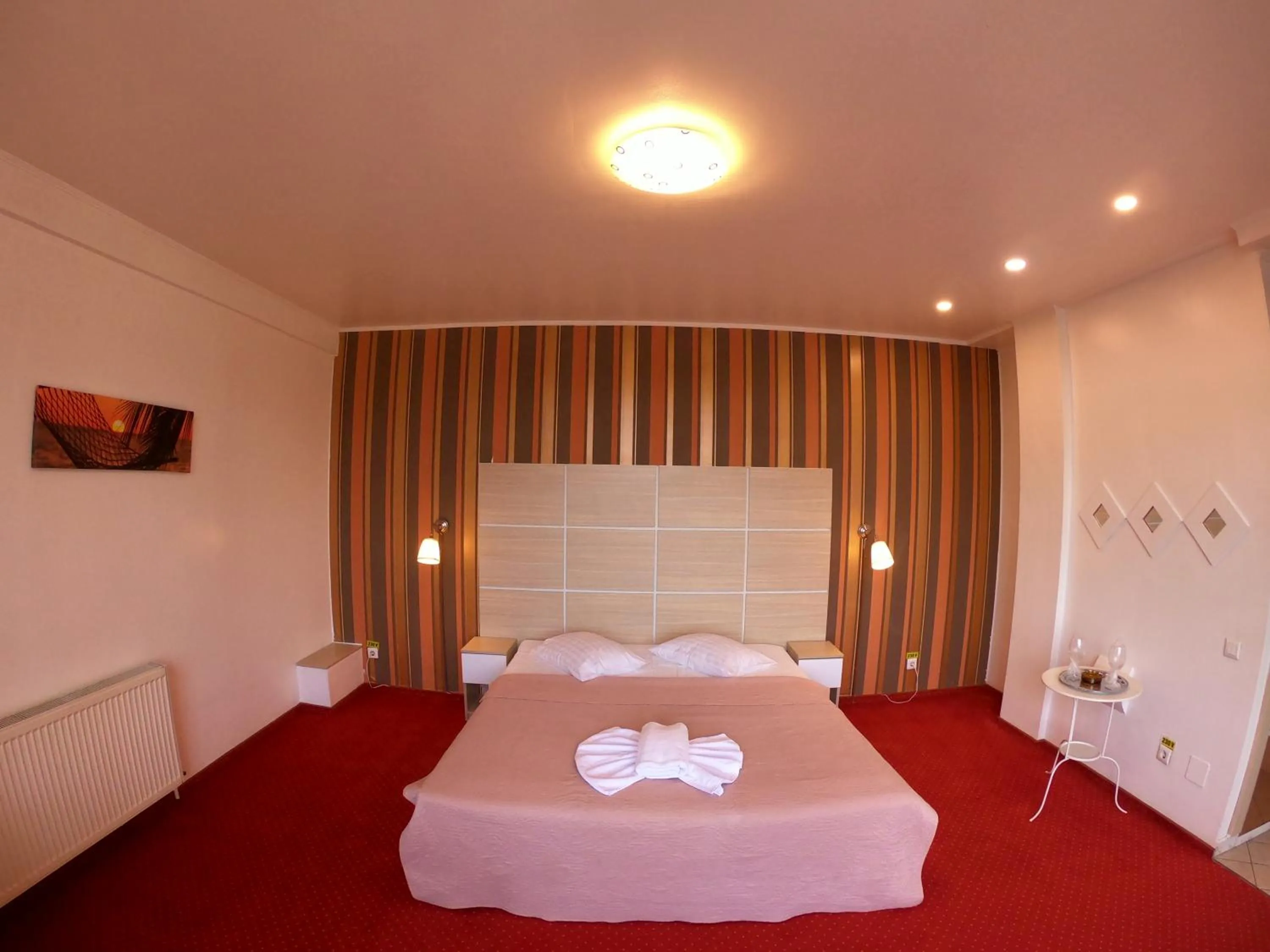 Bed in Hotel Mon Caprice