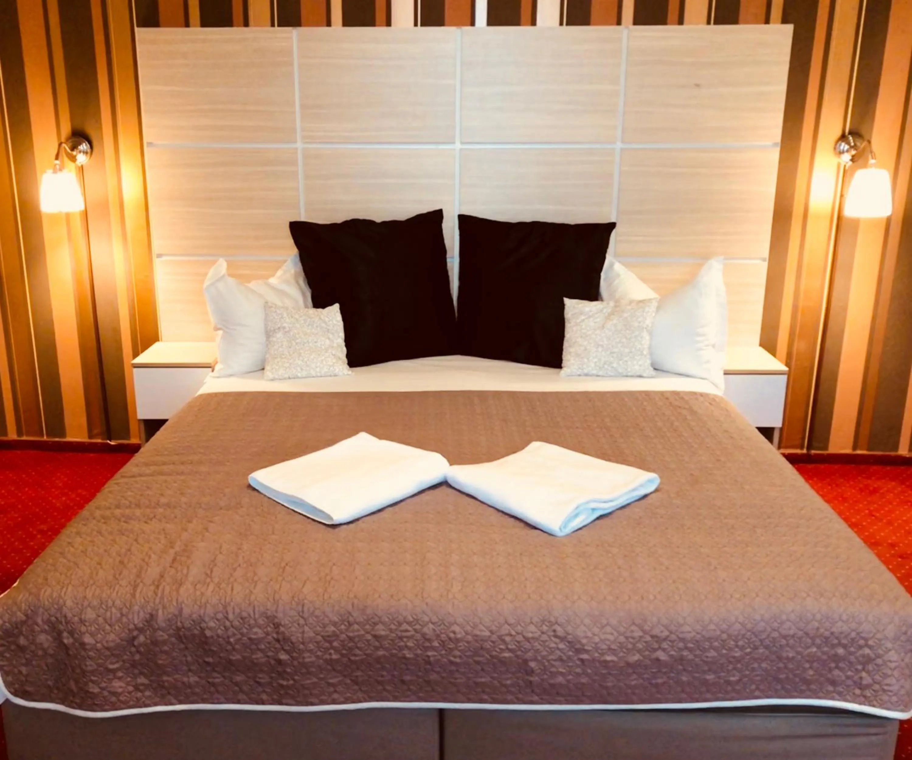 Bed in Hotel Mon Caprice