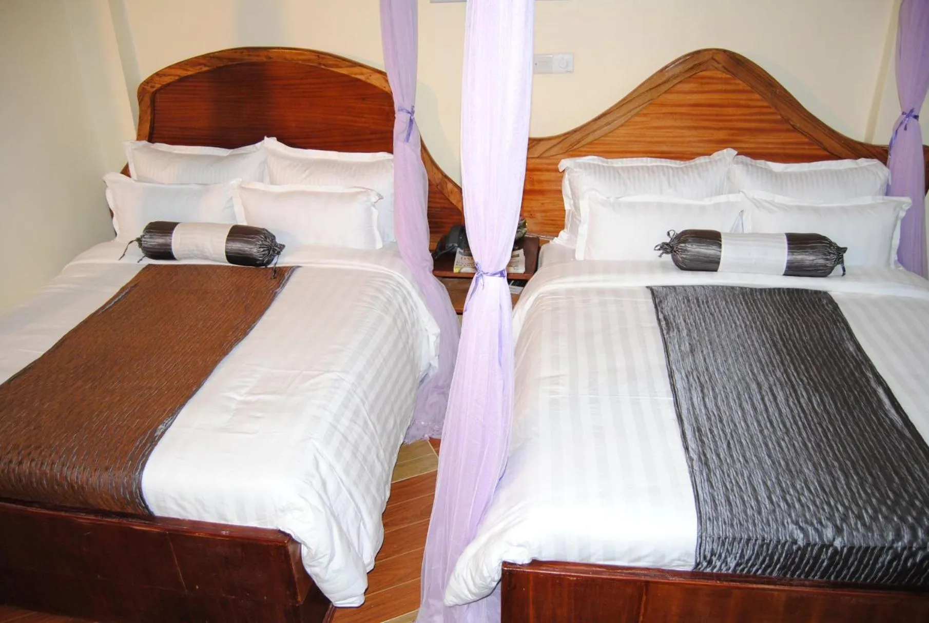 Bed in Aturukan Hotel