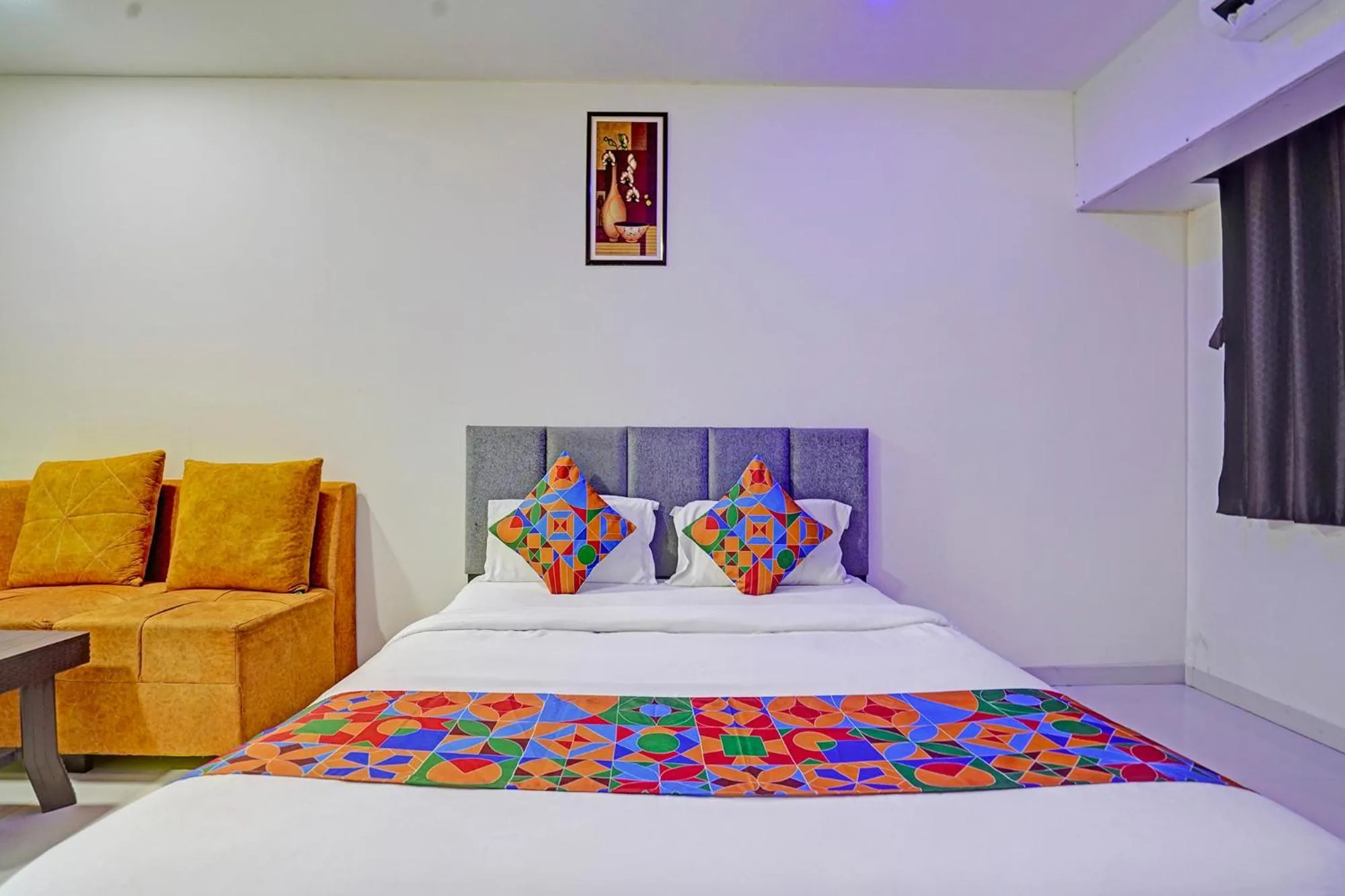 Bed in FabHotel RK Inn