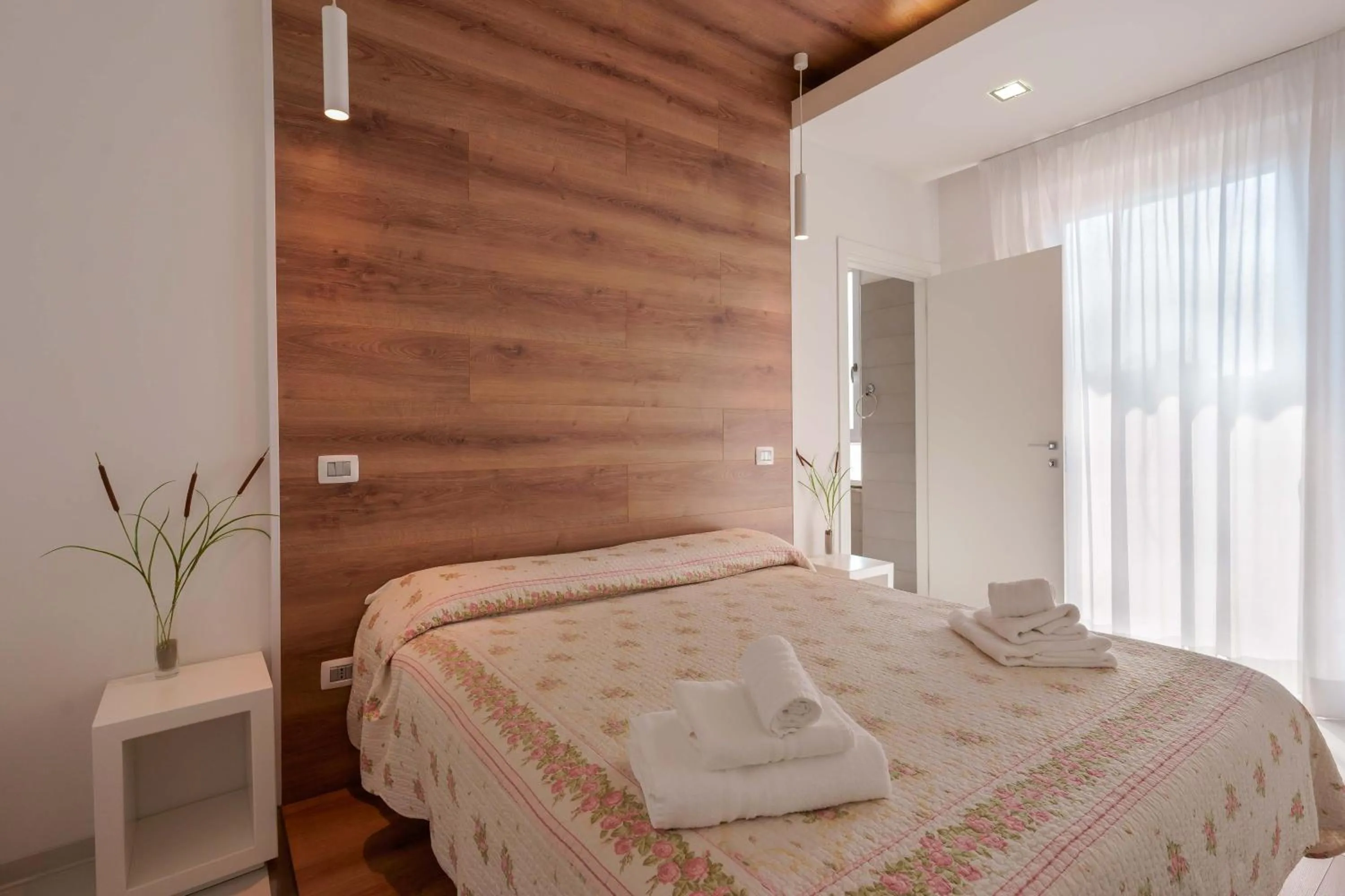 Bed in Lumiere Rooms - Eja Sardinia