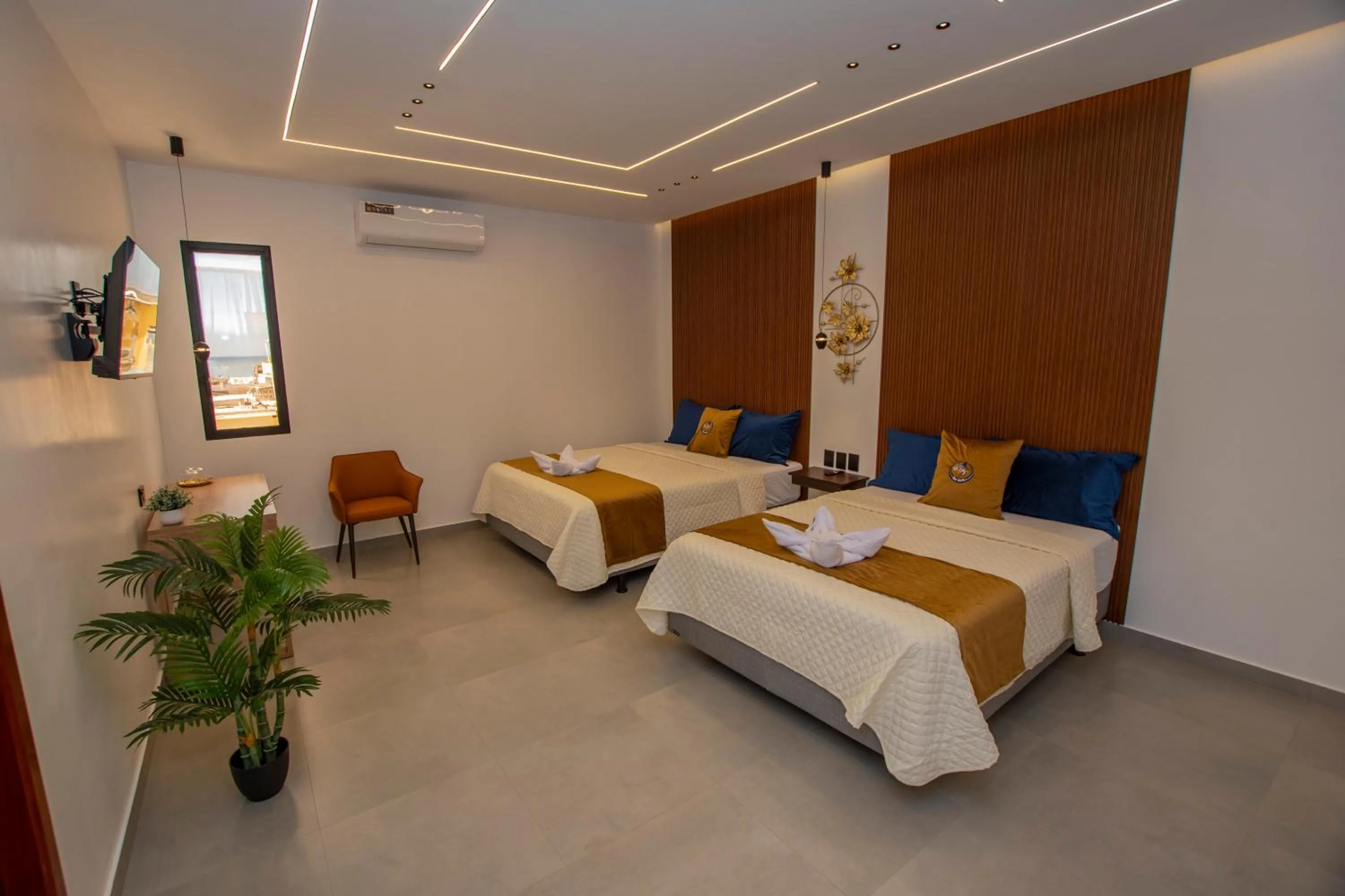 Bed in Blue Marlin Galápagos, Hotel & SPA