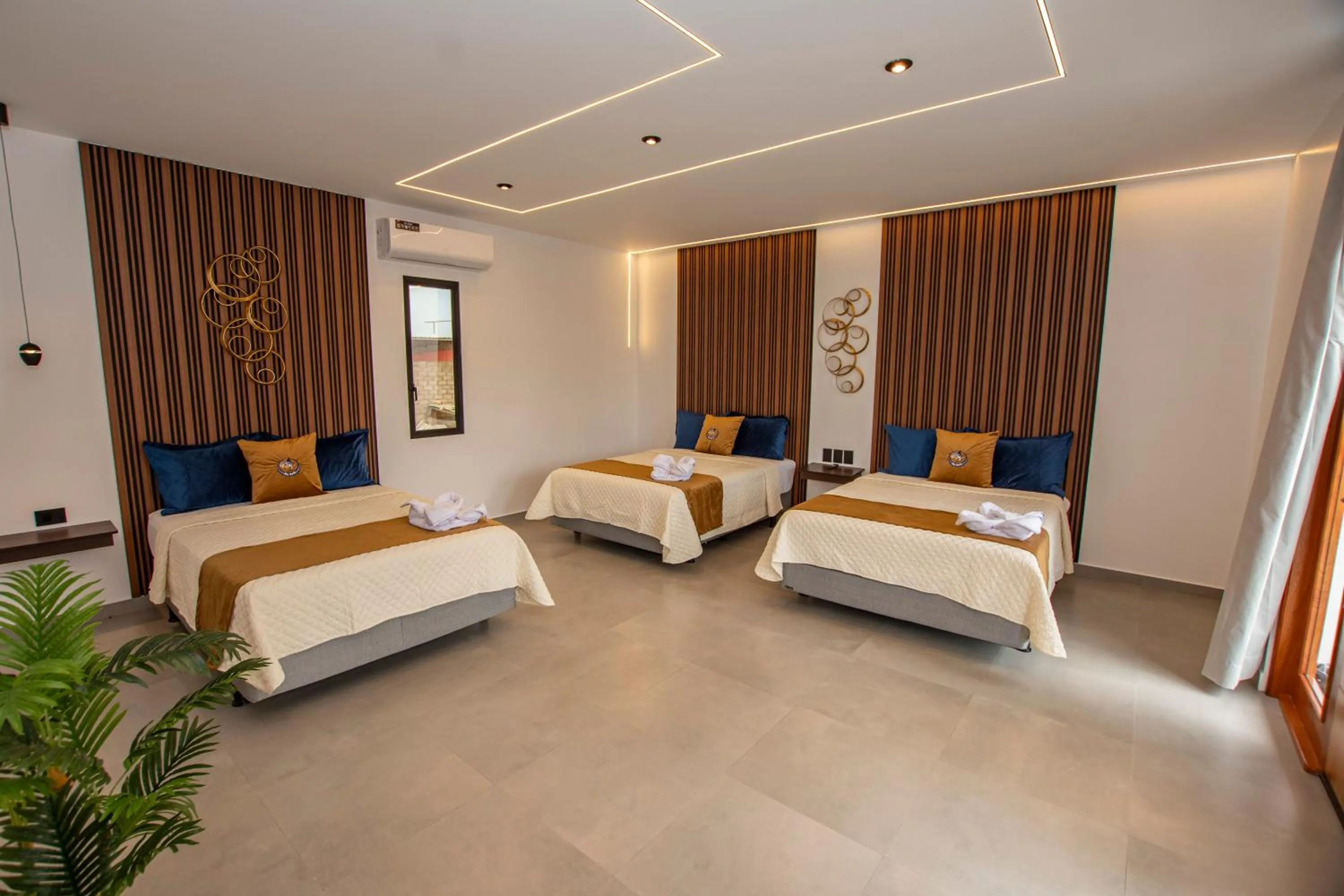 Bed in Blue Marlin Galápagos, Hotel & SPA