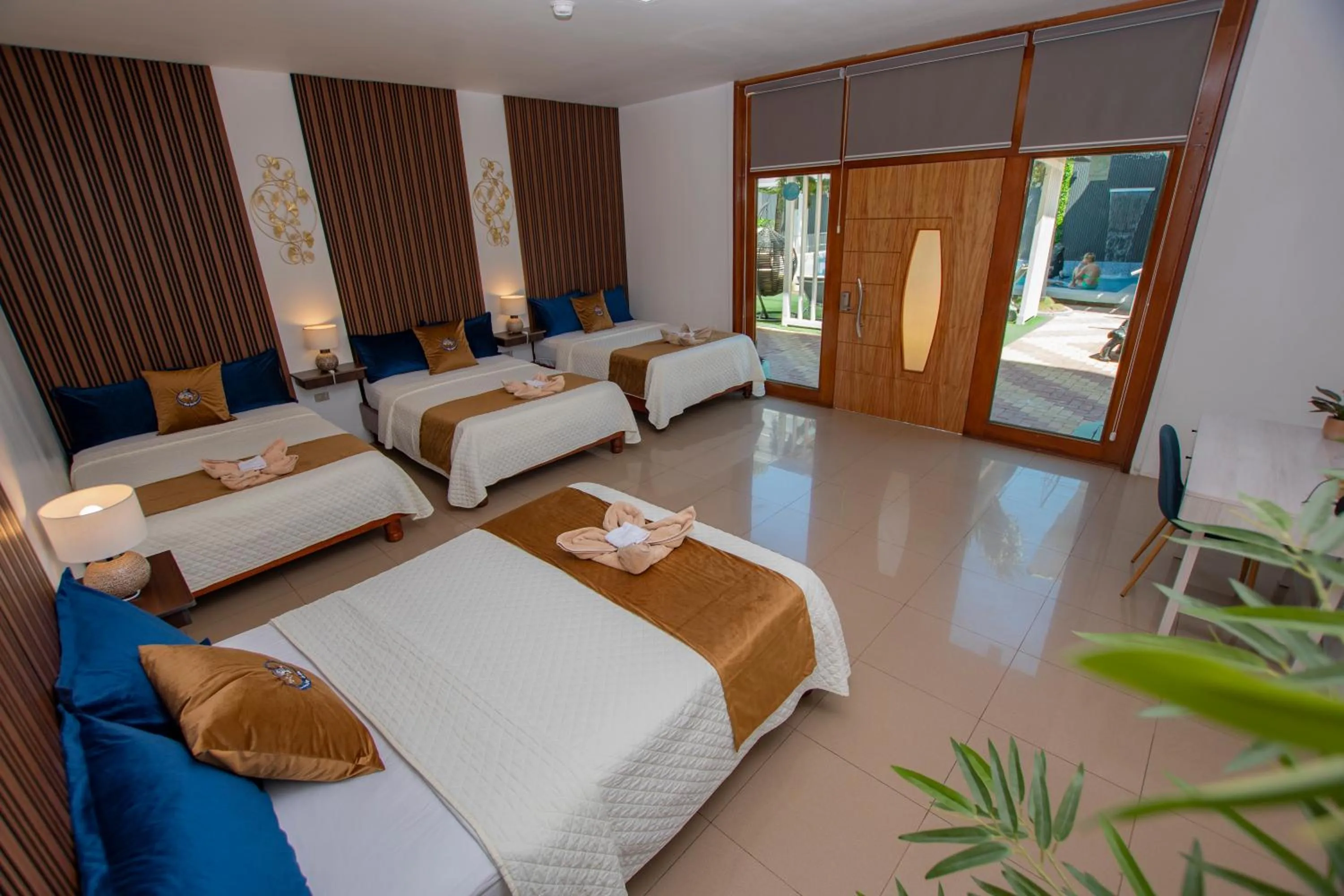 Bed in Blue Marlin Galápagos, Hotel & SPA