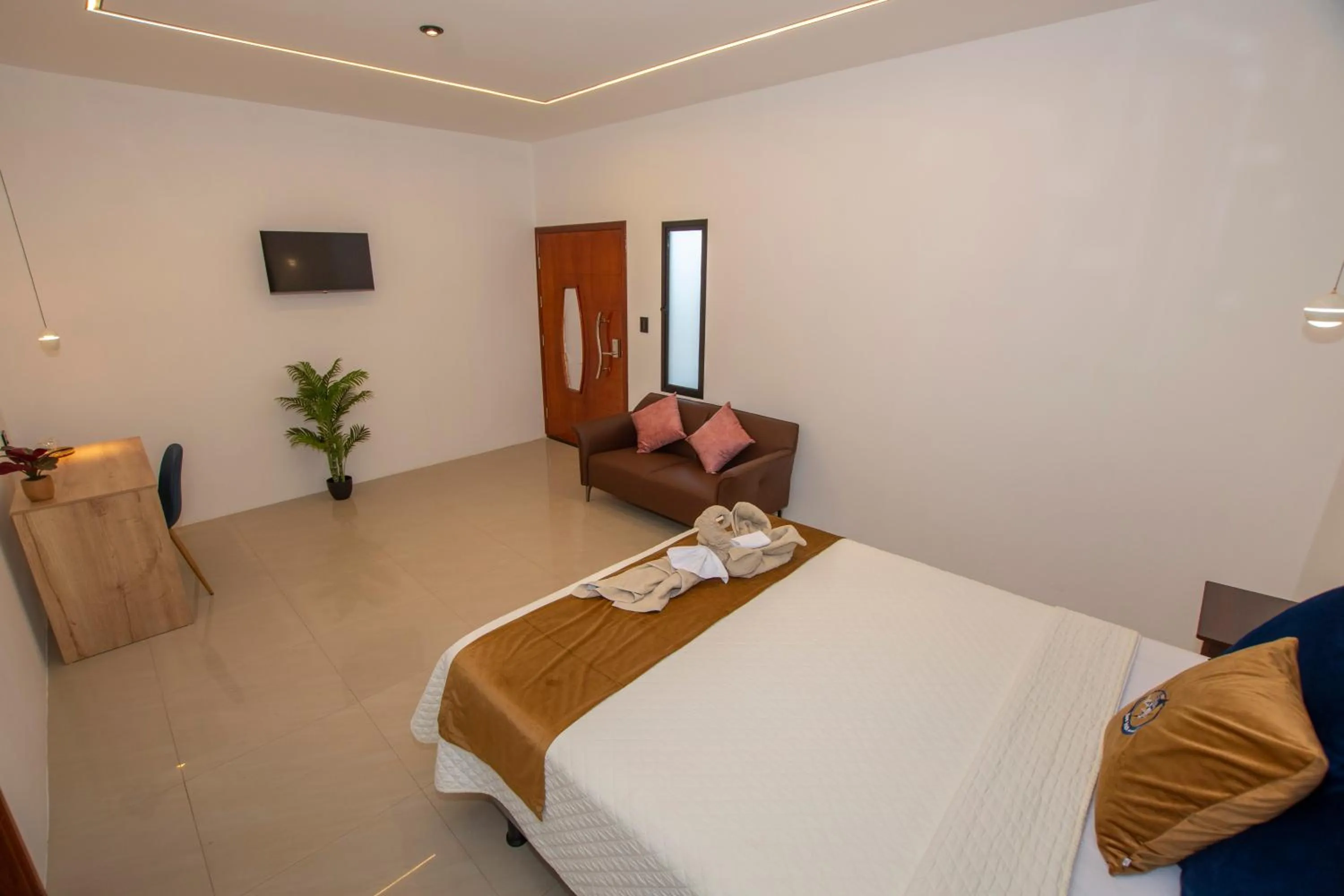 Bed in Blue Marlin Galápagos, Hotel & SPA