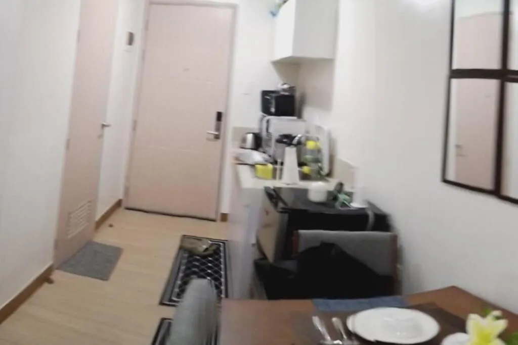 Kitchen or kitchenette in Chelsea Suite's Esthetic Staycation at Trees Residence QC