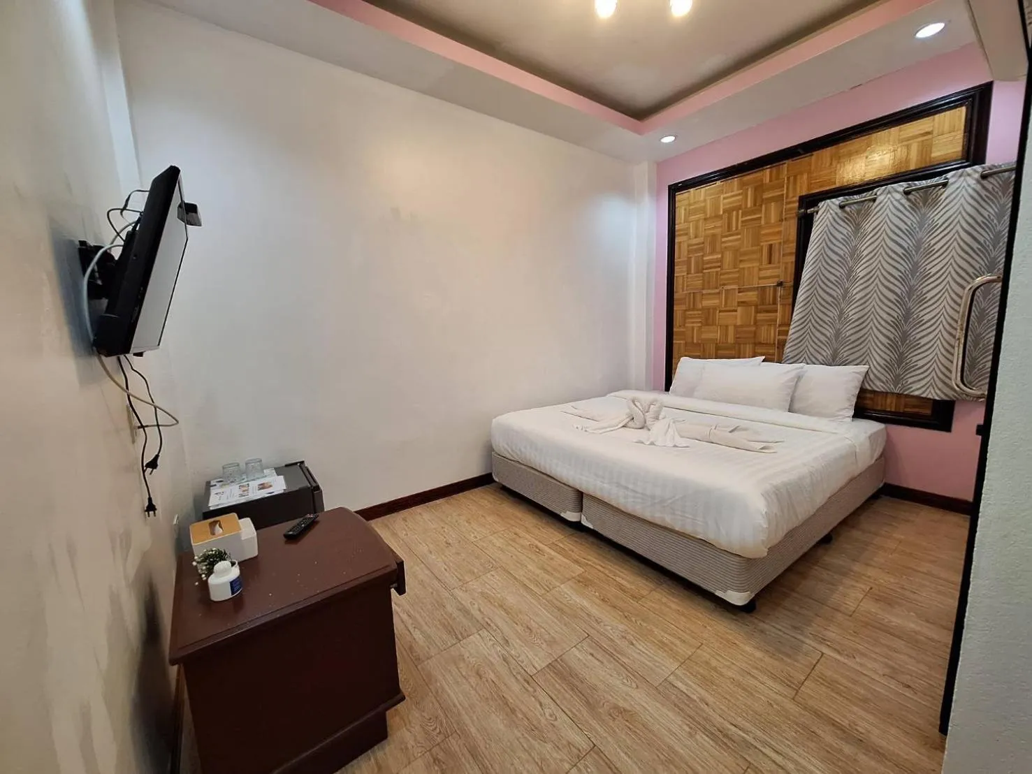 Bed in Kan Home Hotel