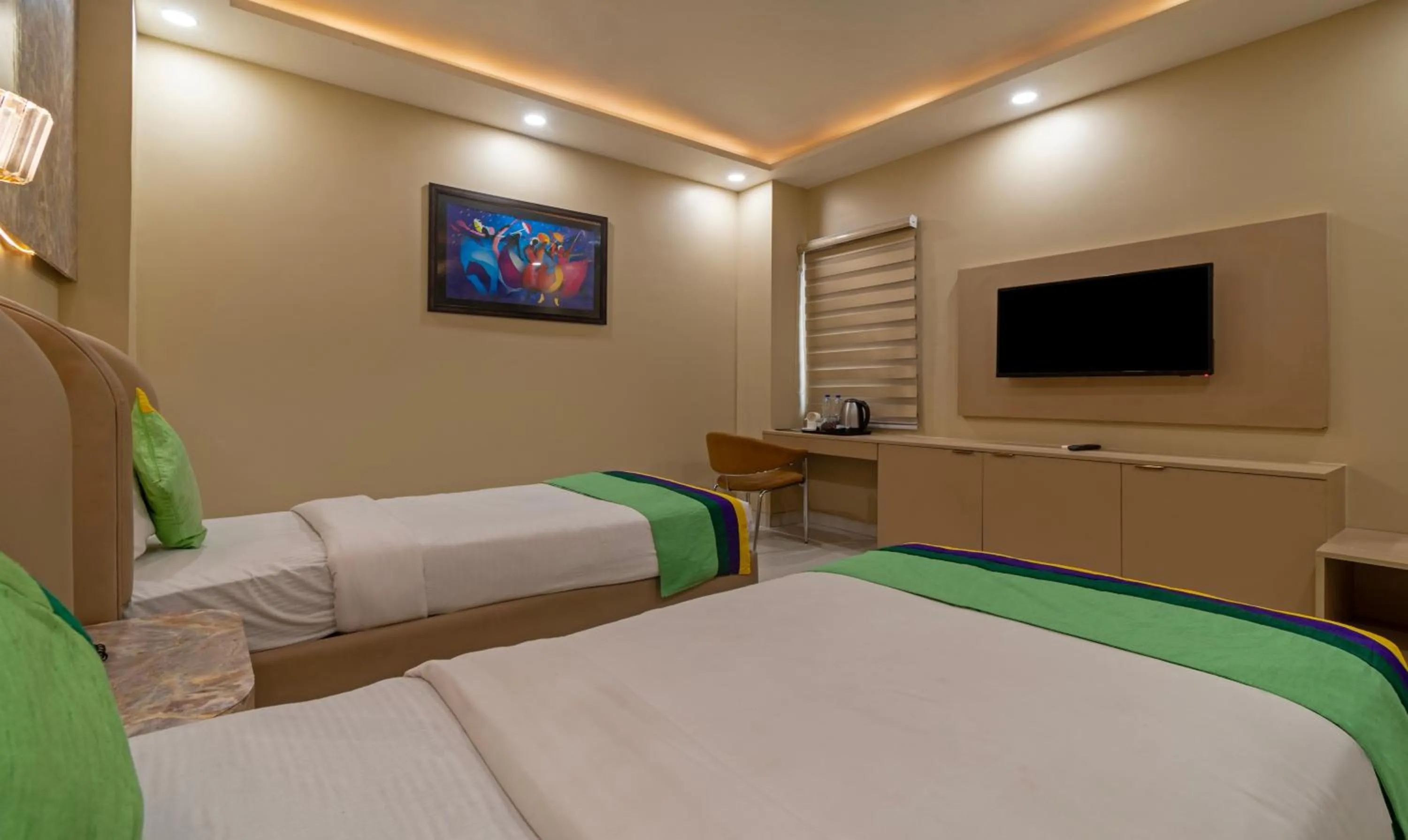 Bed, TV/Entertainment Center in Treebo Trend Mr J - Sec 51