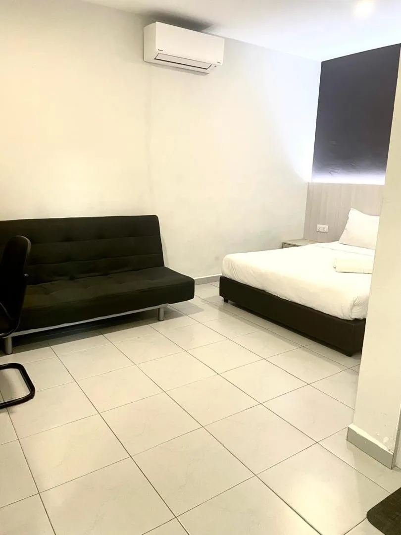 Bed in Garden Inns Motel