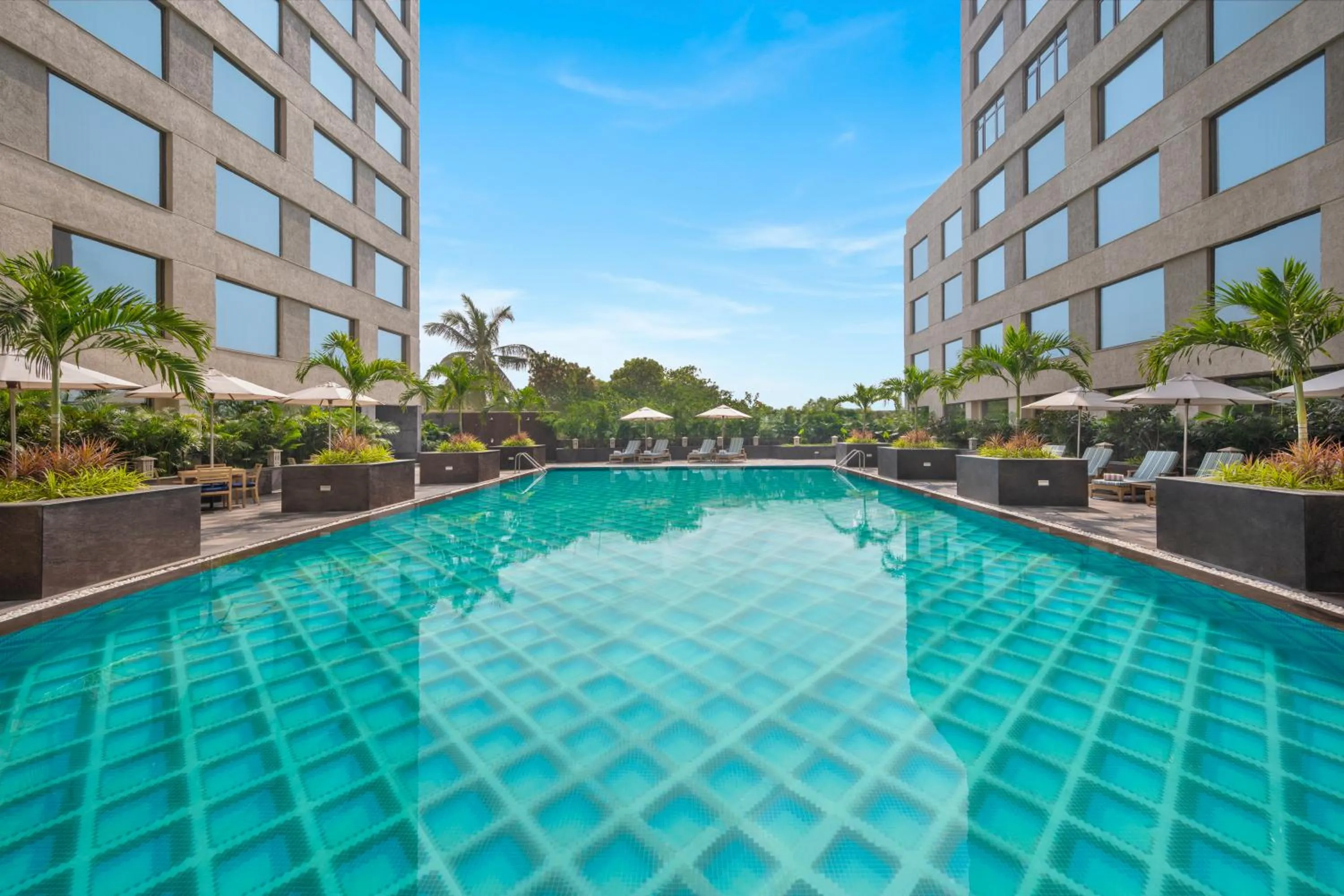 Swimming pool in Aurika, Mumbai International Airport - Luxury by Lemon Tree Hotels