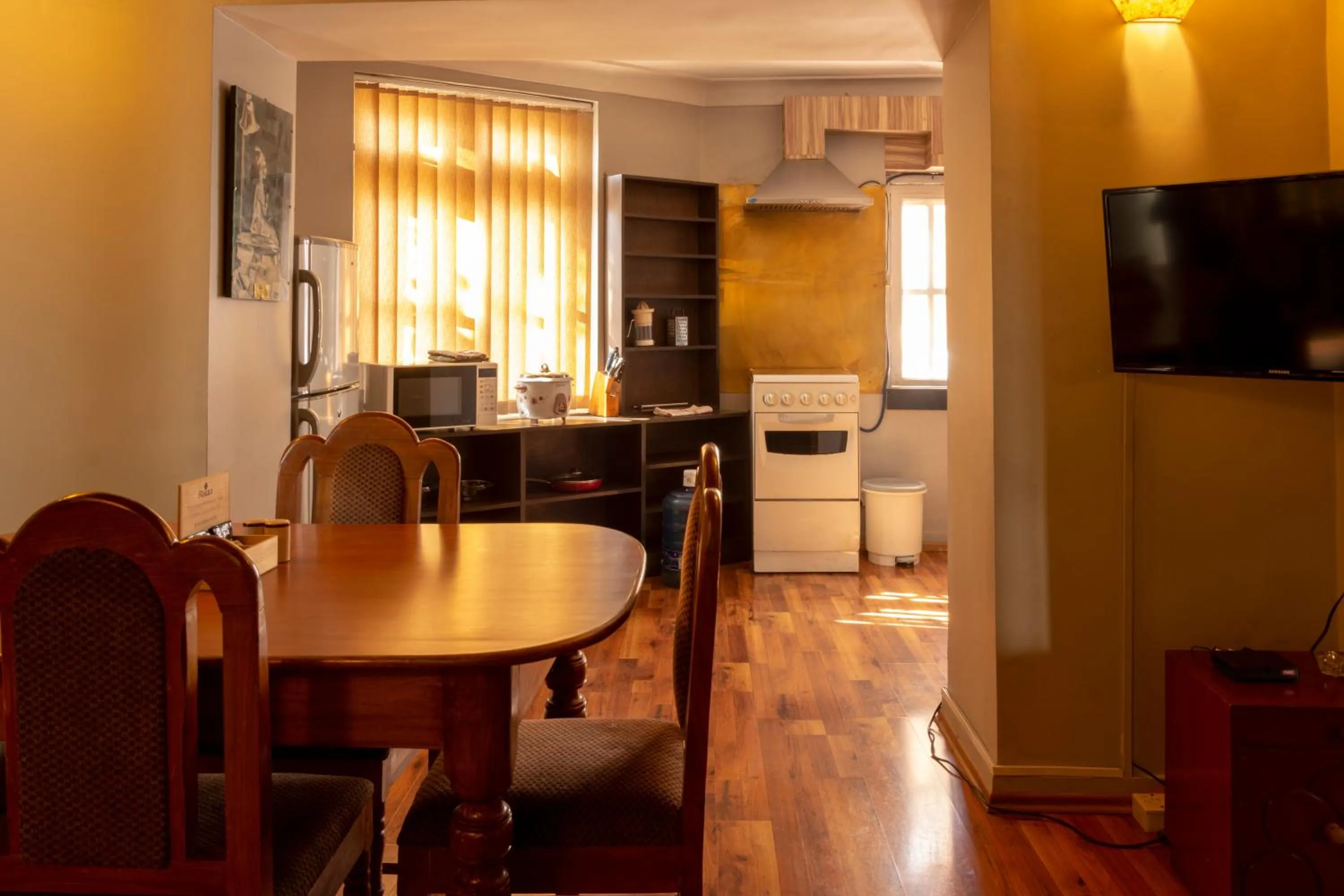 Kitchen or kitchenette in Shaligram Hotel