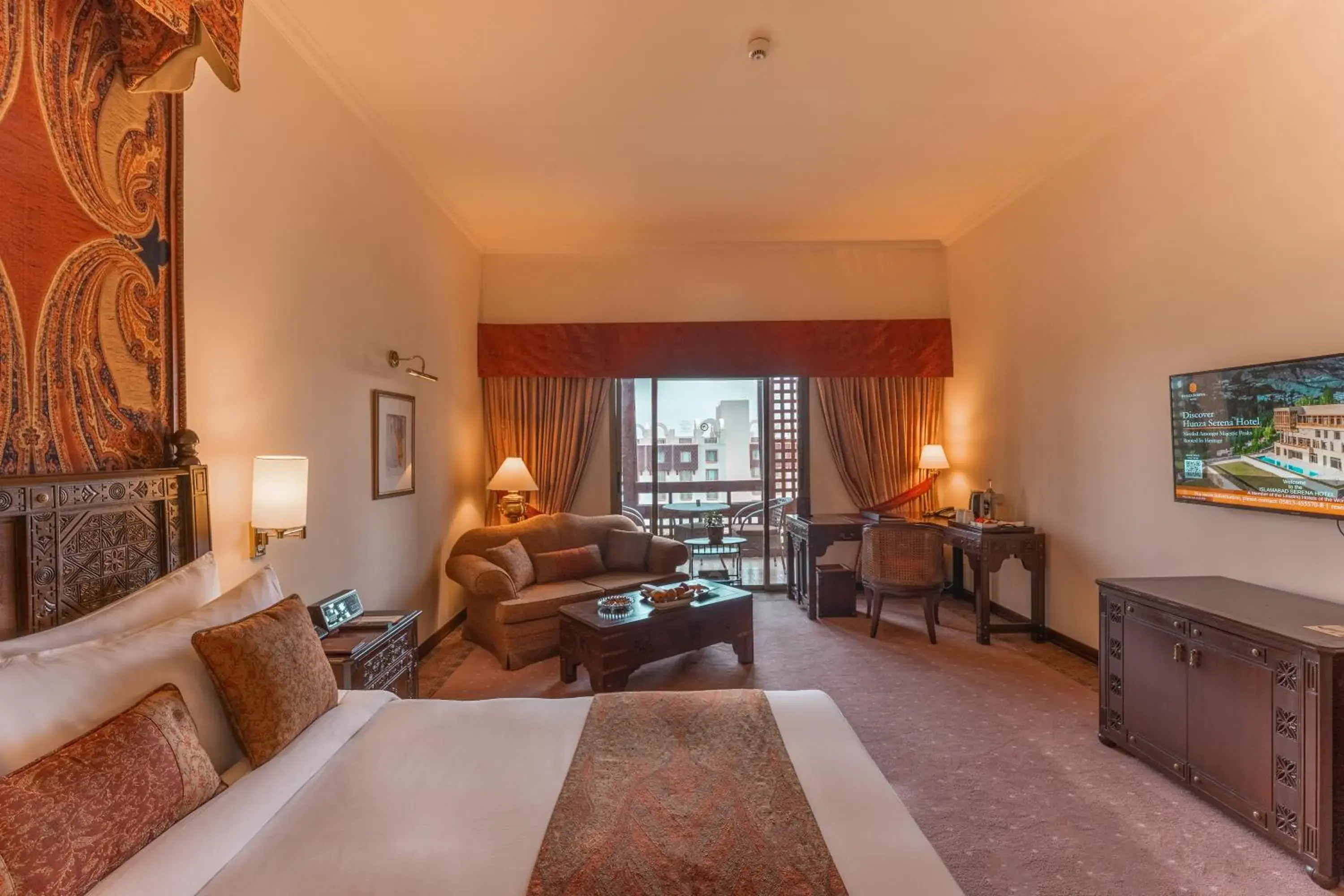 Communal lounge/ TV room, Bed in Islamabad Serena Hotel Communal lounge/ TV room, Bed in Islamabad Serena Hotel