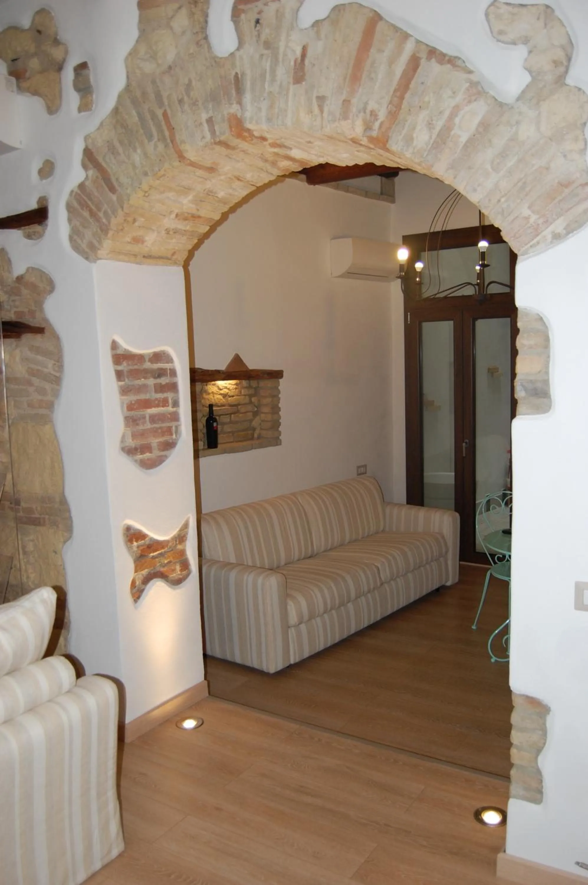 Seating area, Bed in Archè