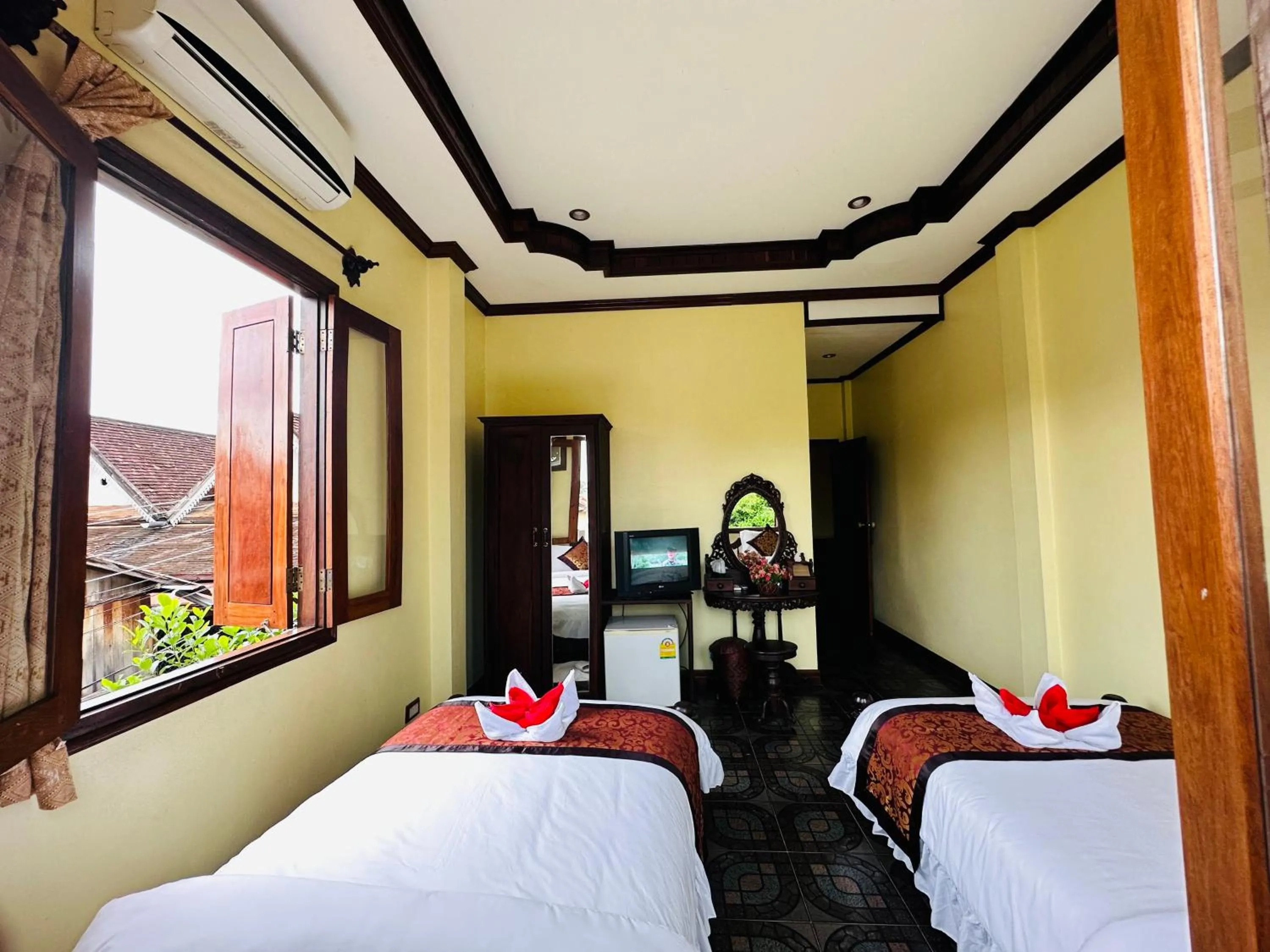 Communal lounge/ TV room, Bed in Visoun Luang Prabang Hotel