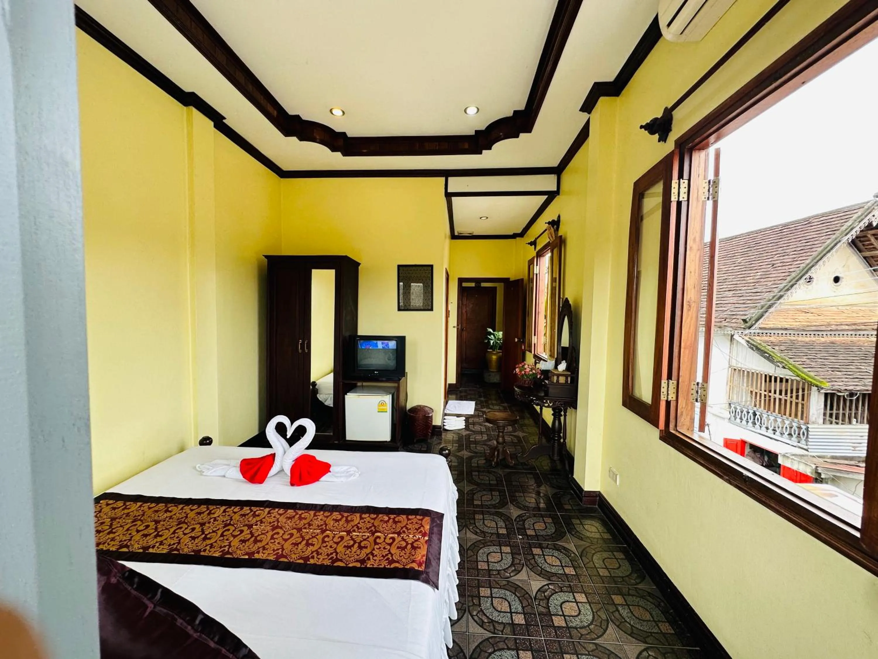 Communal lounge/ TV room, Bed in Visoun Luang Prabang Hotel