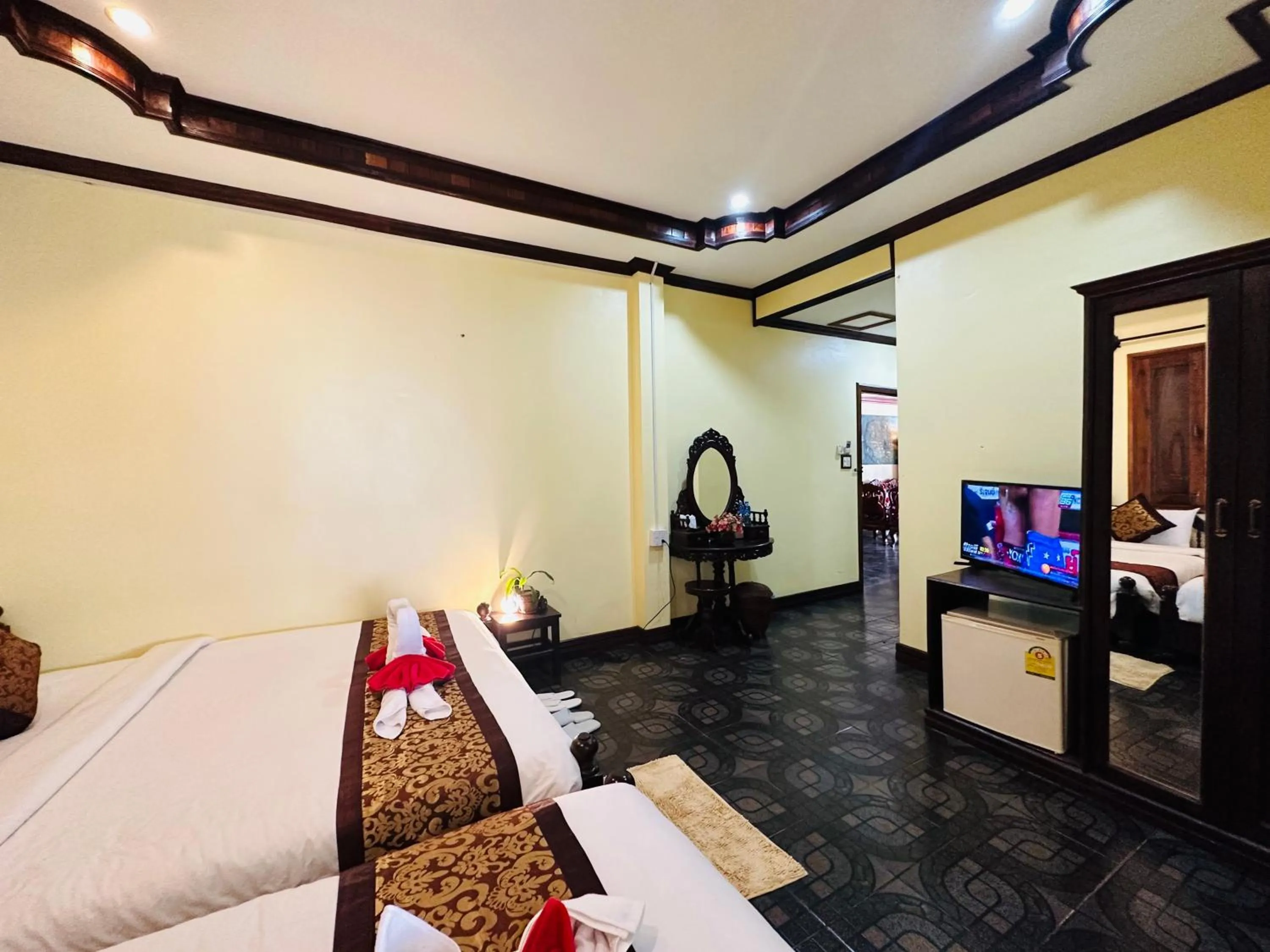 Communal lounge/ TV room, Bed in Visoun Luang Prabang Hotel