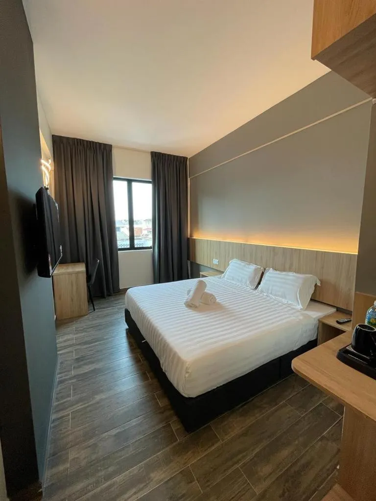 Bed in DJ Citi Plaza Hotel & Suites