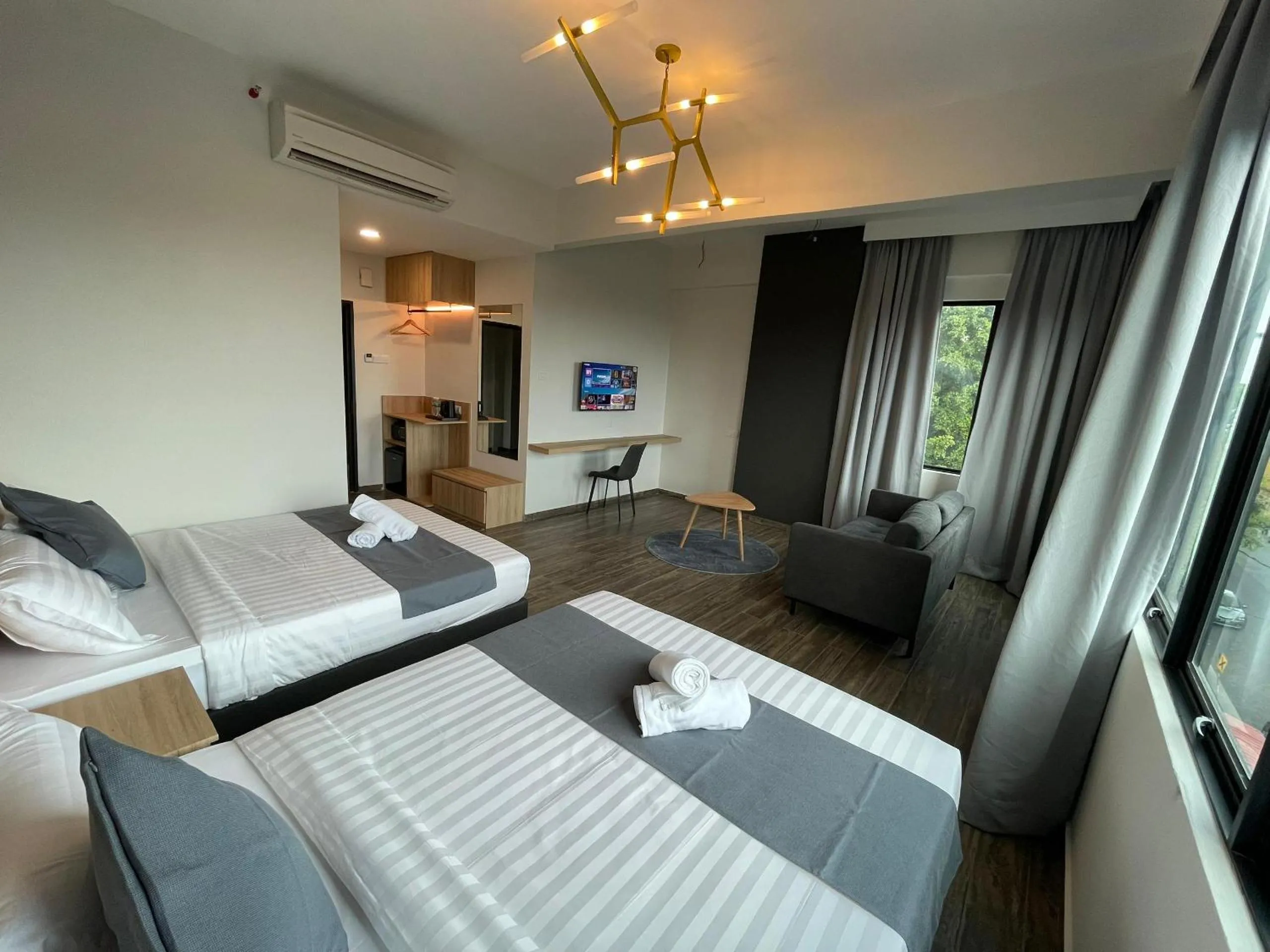 Bed in DJ Citi Plaza Hotel & Suites
