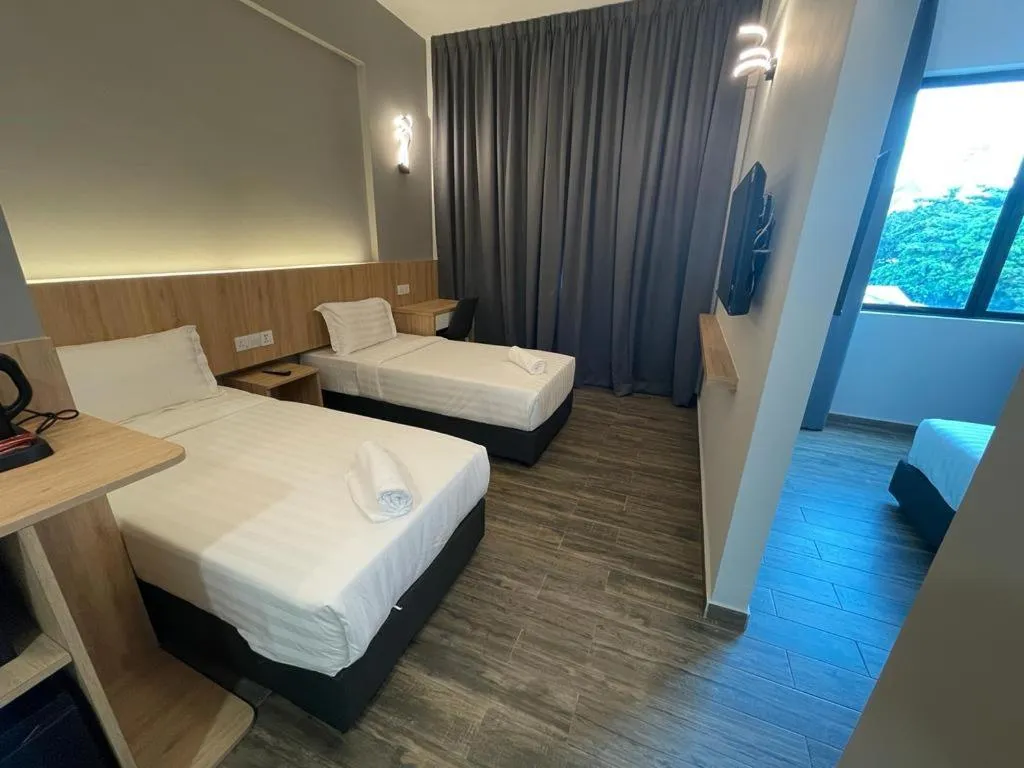 Bed in DJ Citi Plaza Hotel & Suites