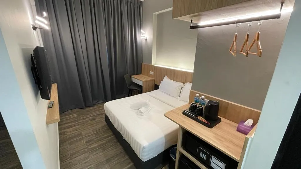 Bed in DJ Citi Plaza Hotel & Suites