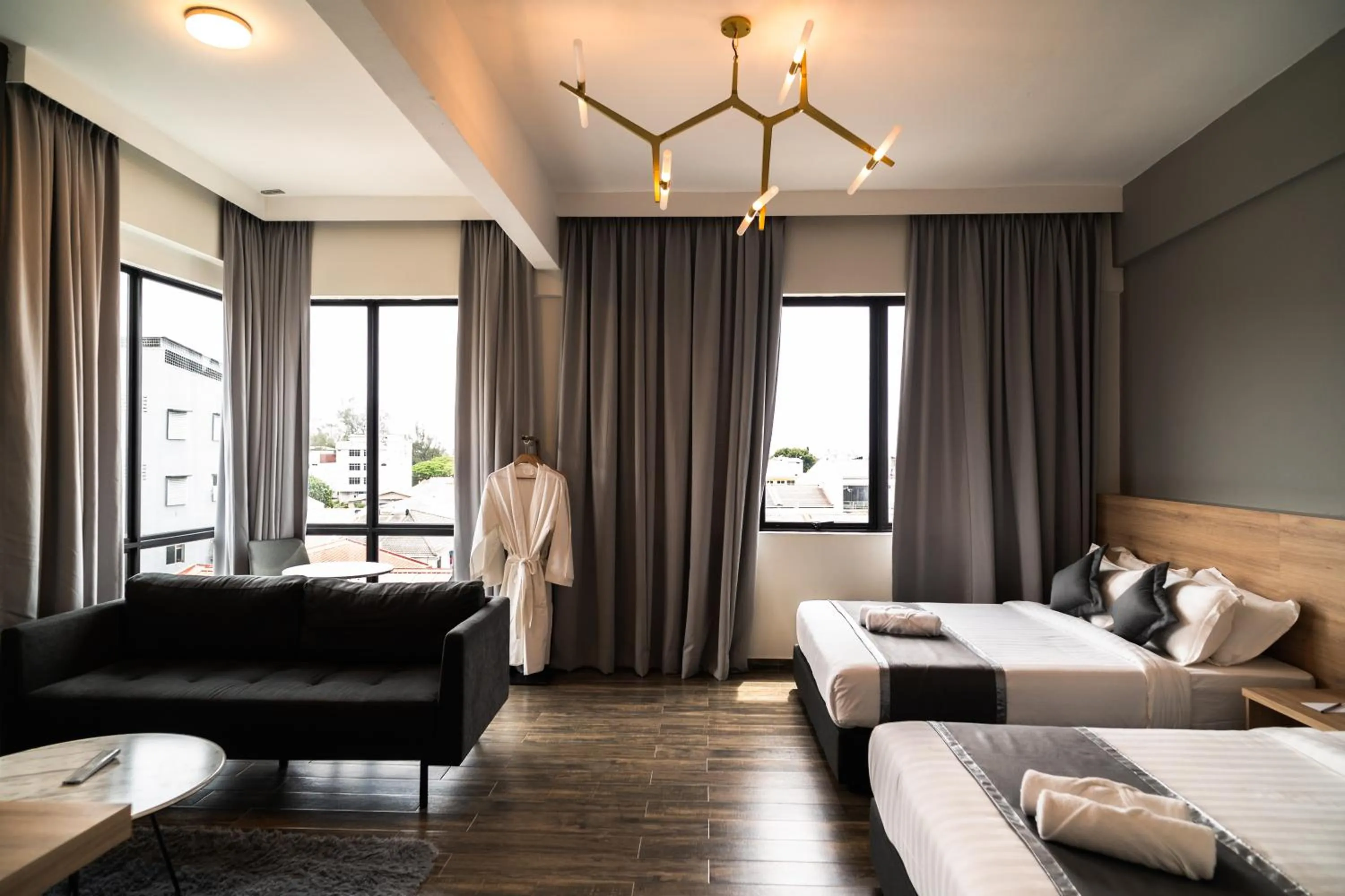 Bed in DJ Citi Plaza Hotel & Suites