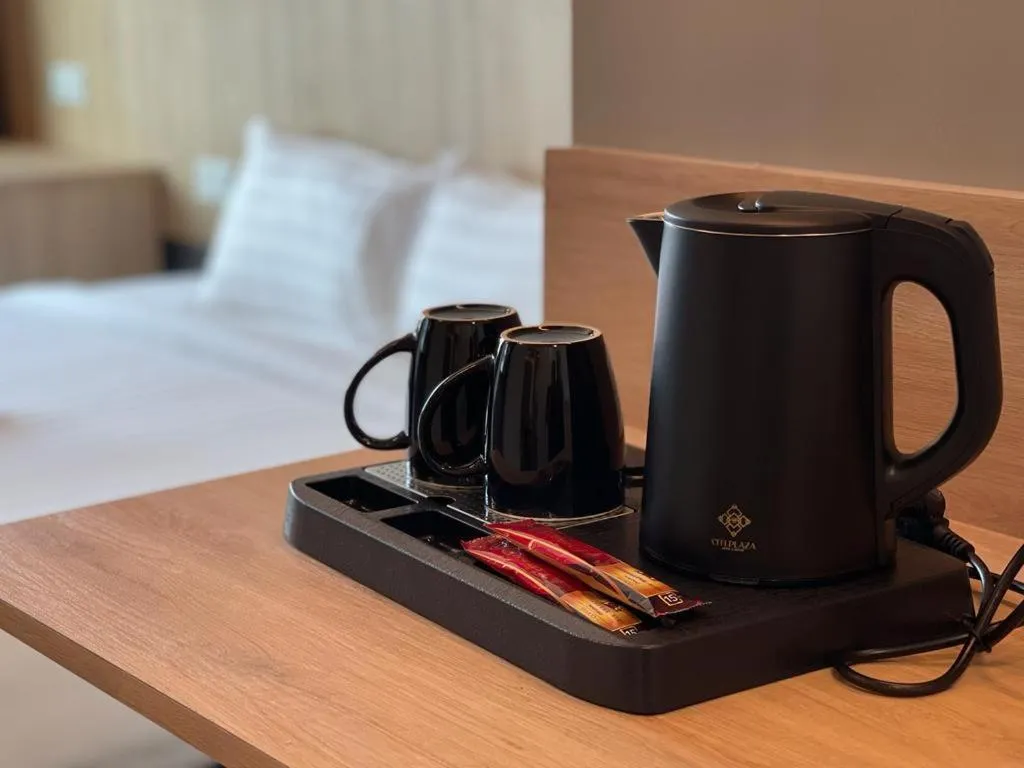 Bed in DJ Citi Plaza Hotel & Suites