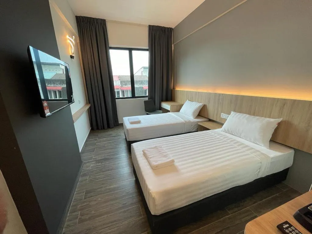Bed in DJ Citi Plaza Hotel & Suites
