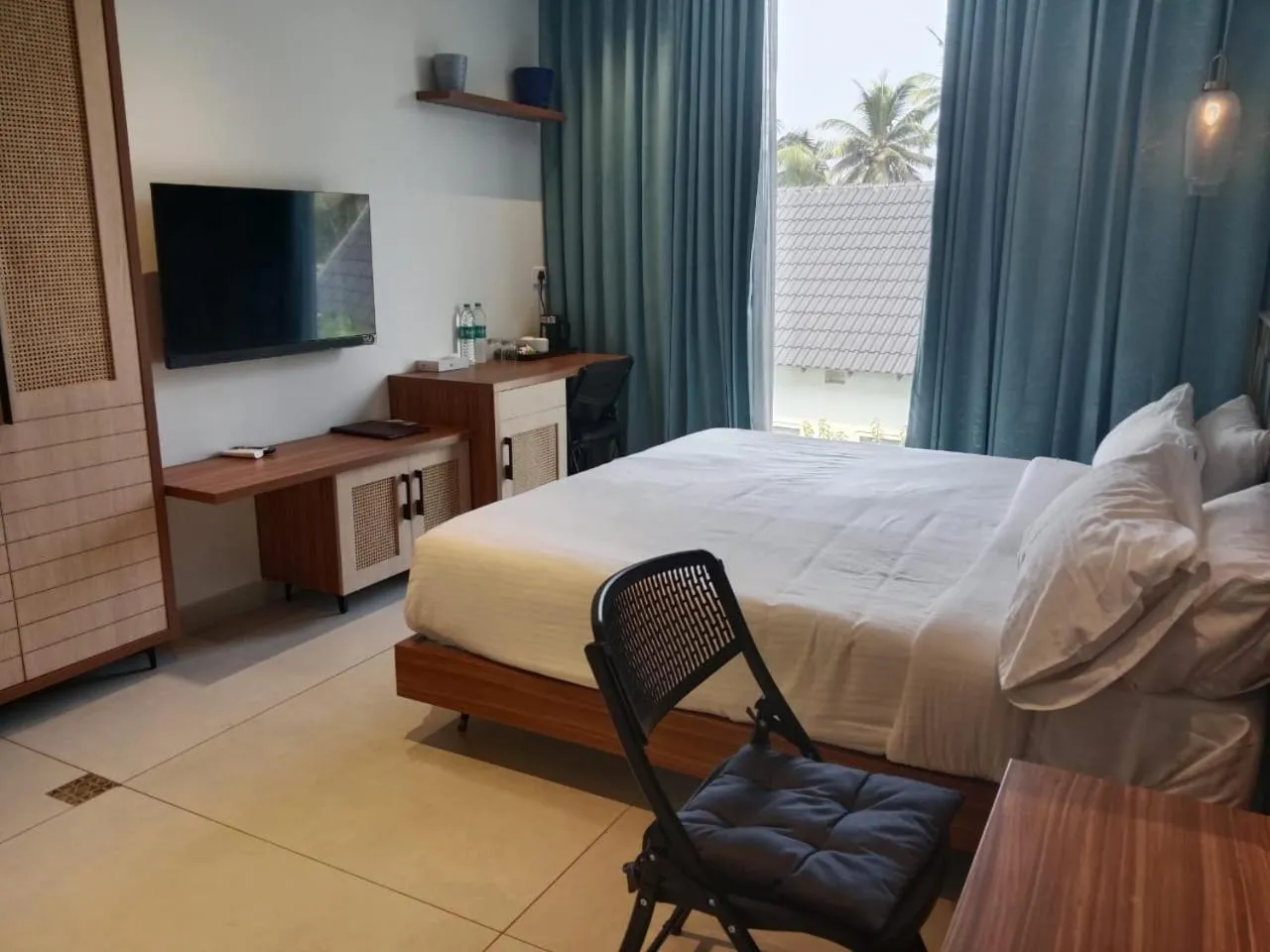 Bed in ANANSA BOUTIQUE HOTEL by The Kannur Club