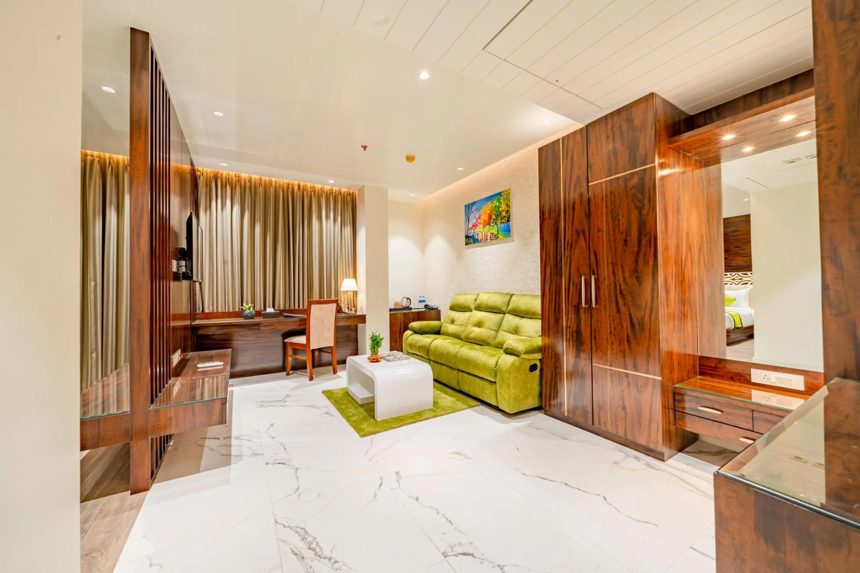 Living room, Bed in Payel Inn