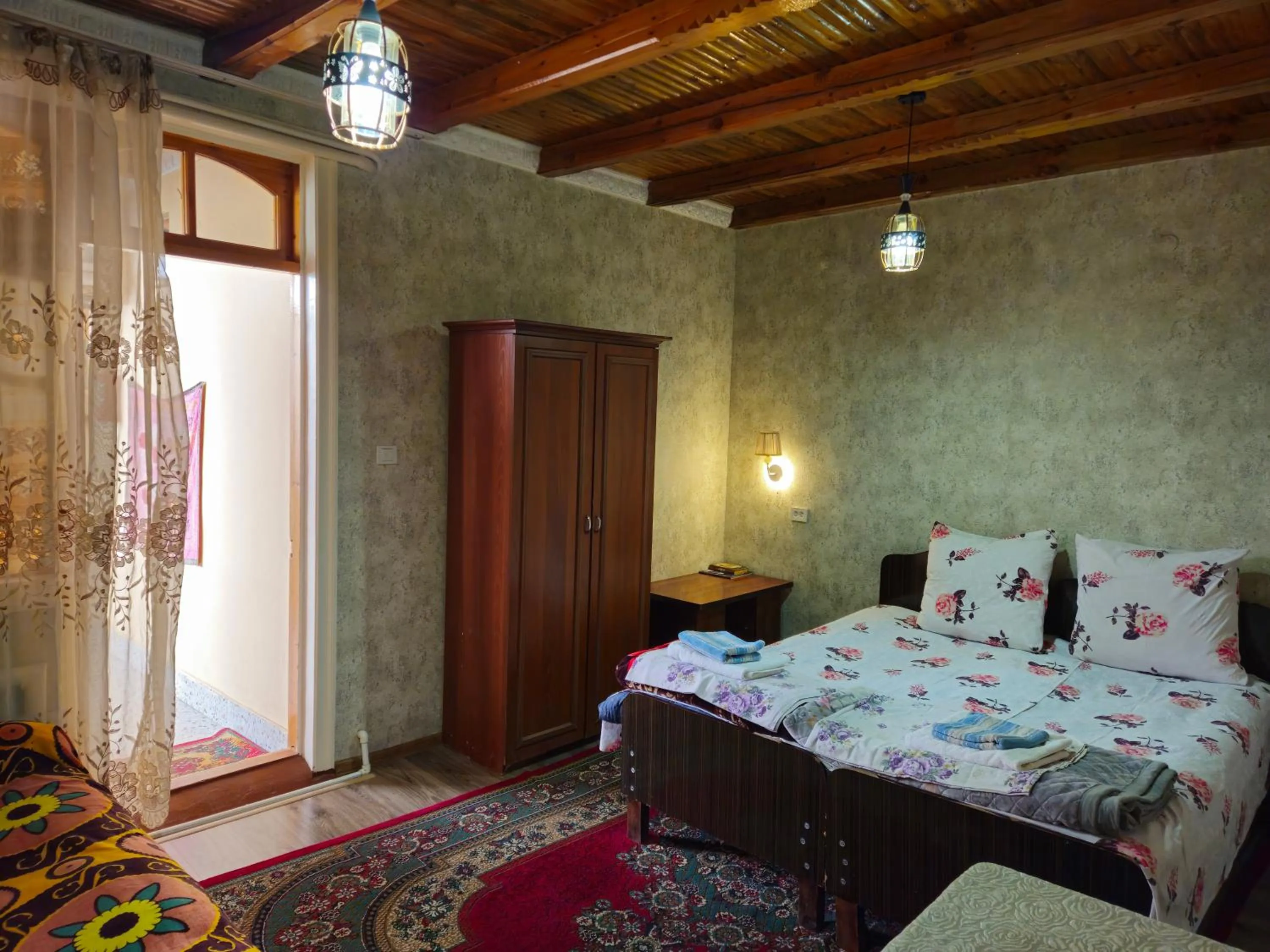 Bed in B&B Bahodir