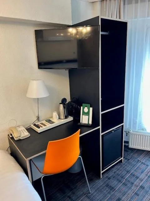 Bed in Multatuli Hotel