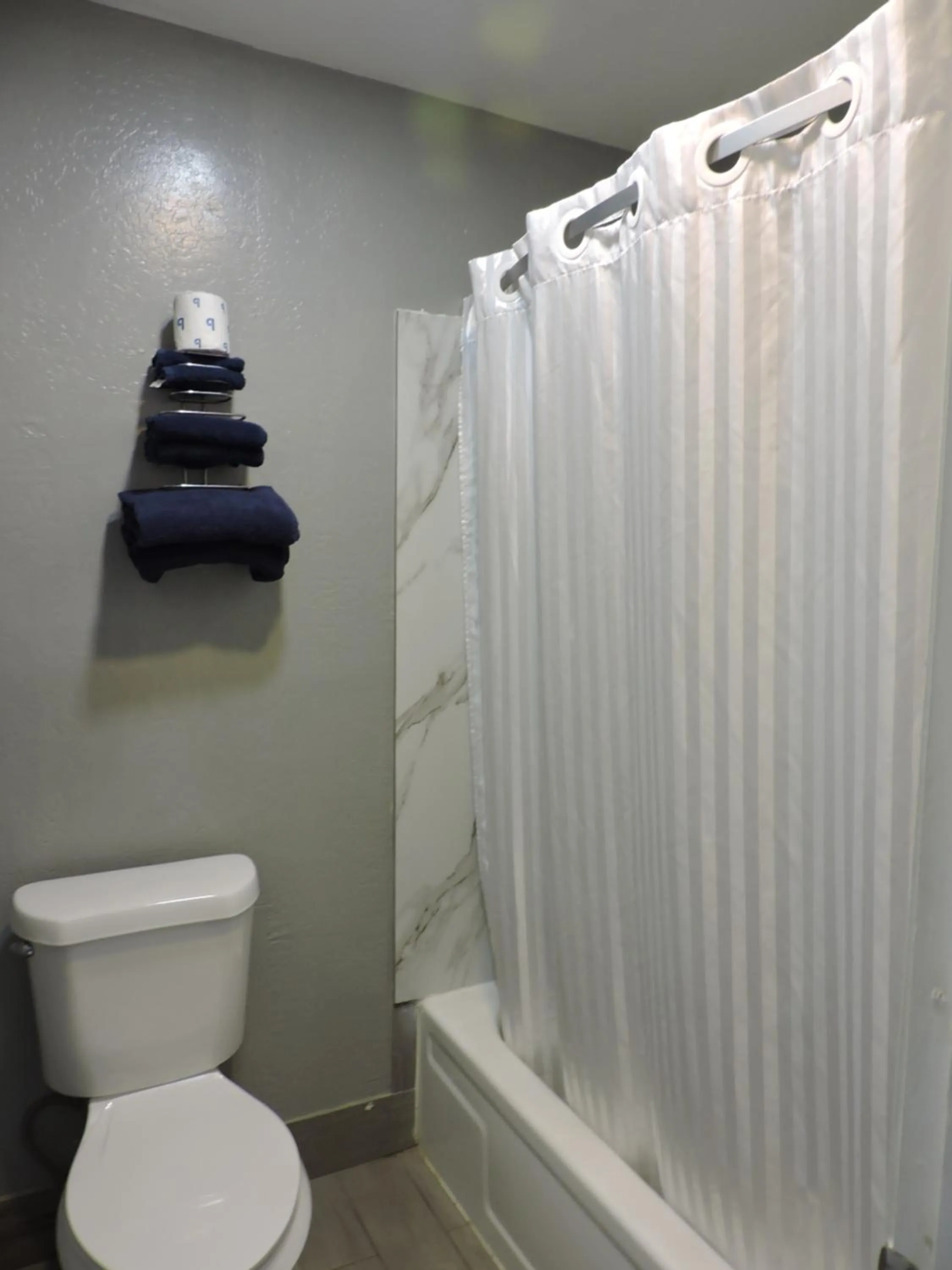 Toilet in Coachman's Inn & Suites