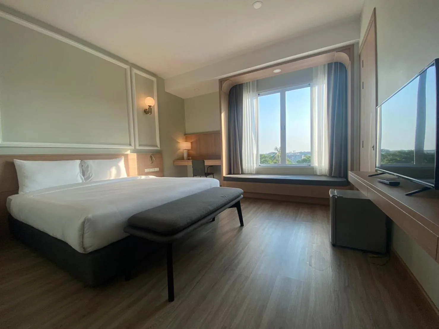 Bed in Mayflower Grande Suite Hotel