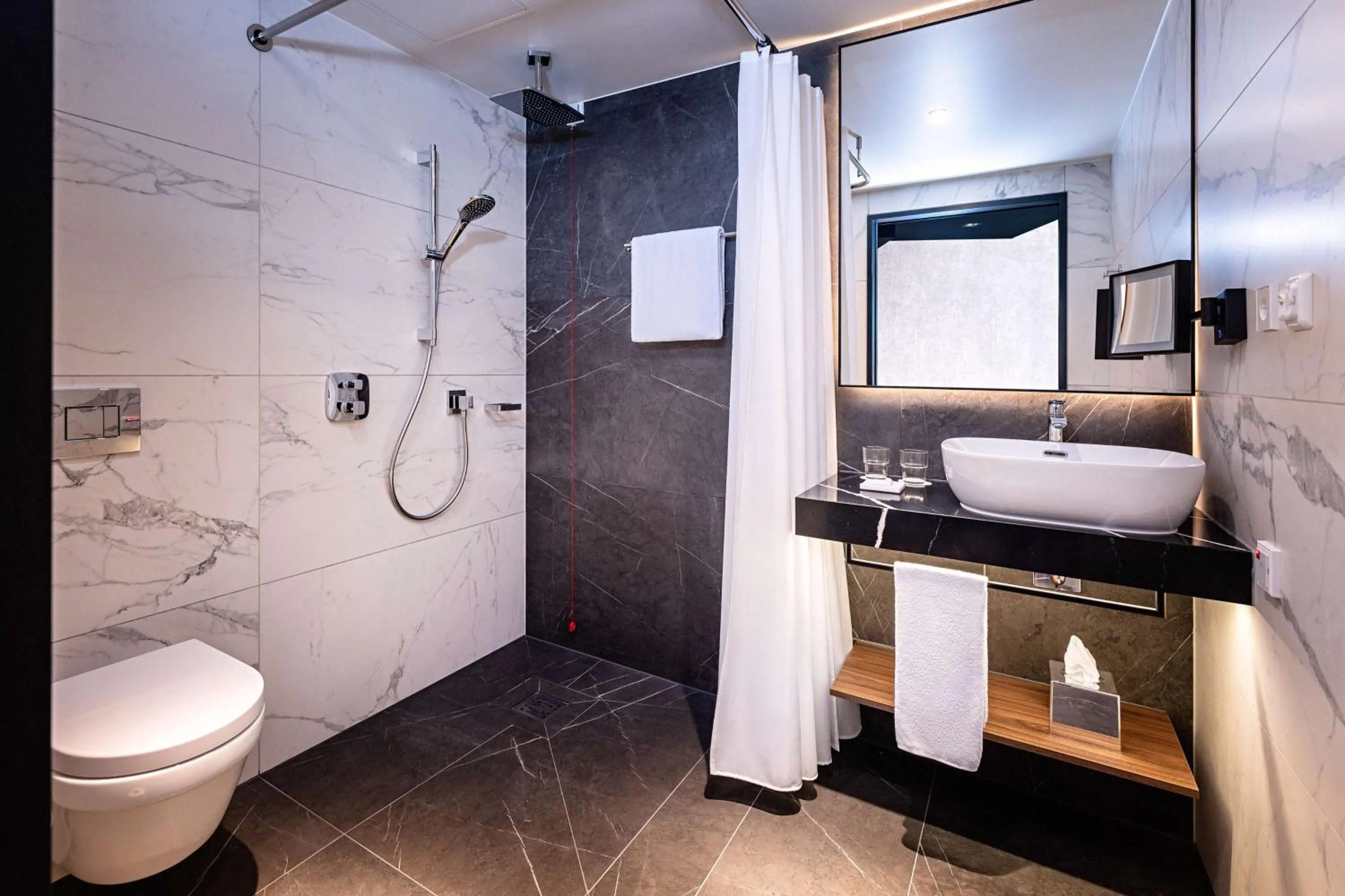 Bathroom in Radisson Blu Hotel at Porsche Design Tower Stuttgart