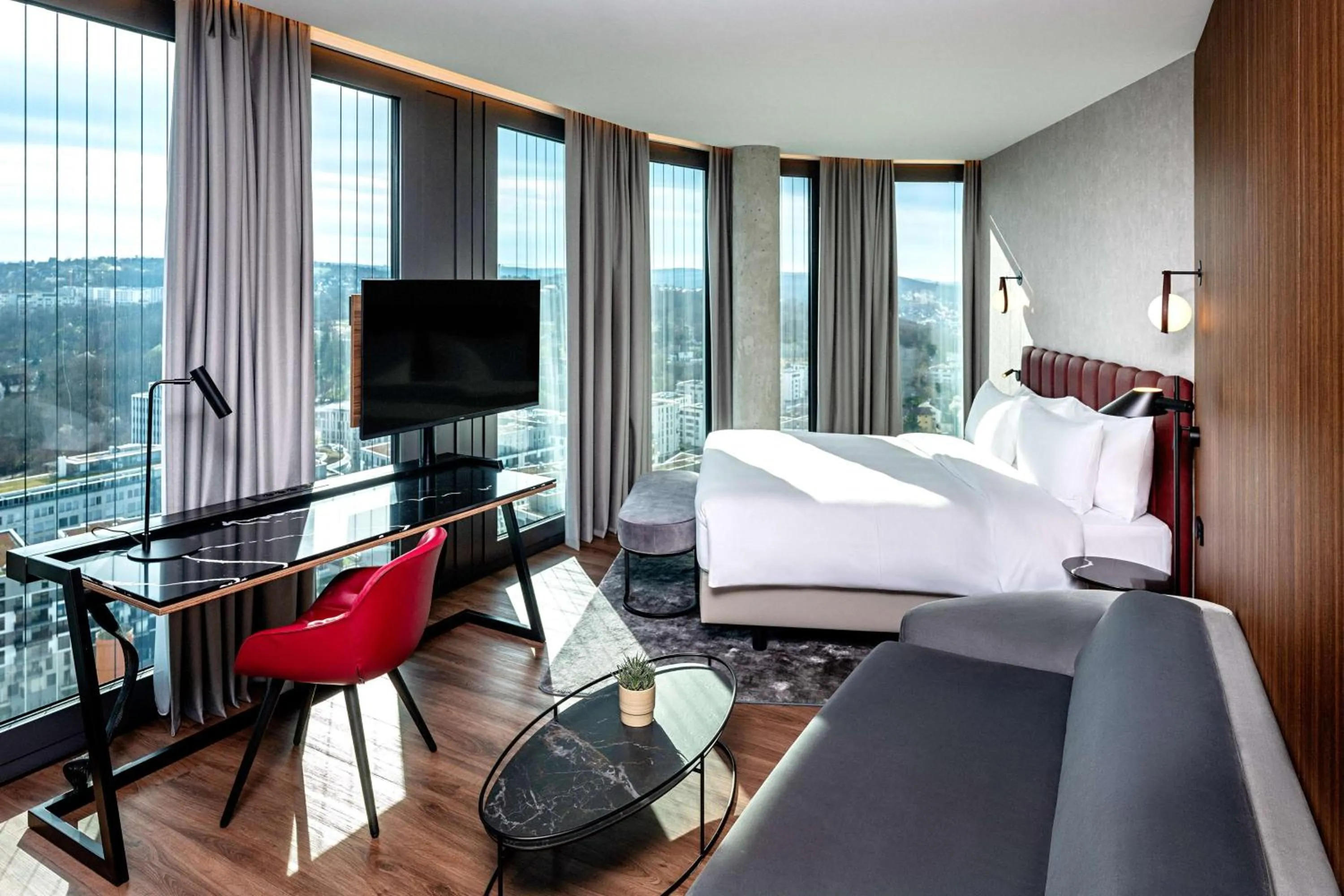 Photo of the whole room, Bed in Radisson Blu Hotel at Porsche Design Tower Stuttgart