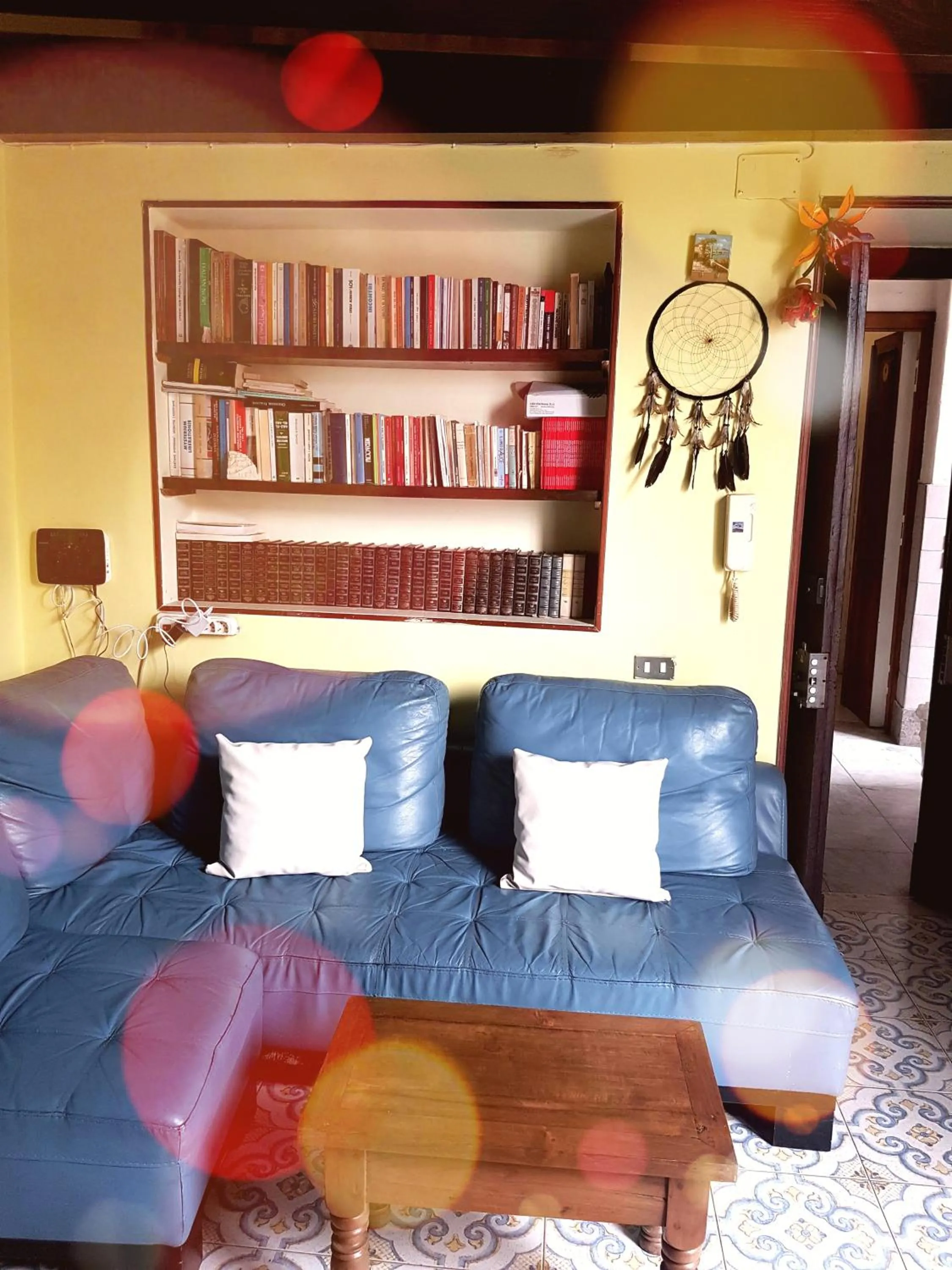 Library in GoldenCube Guest House