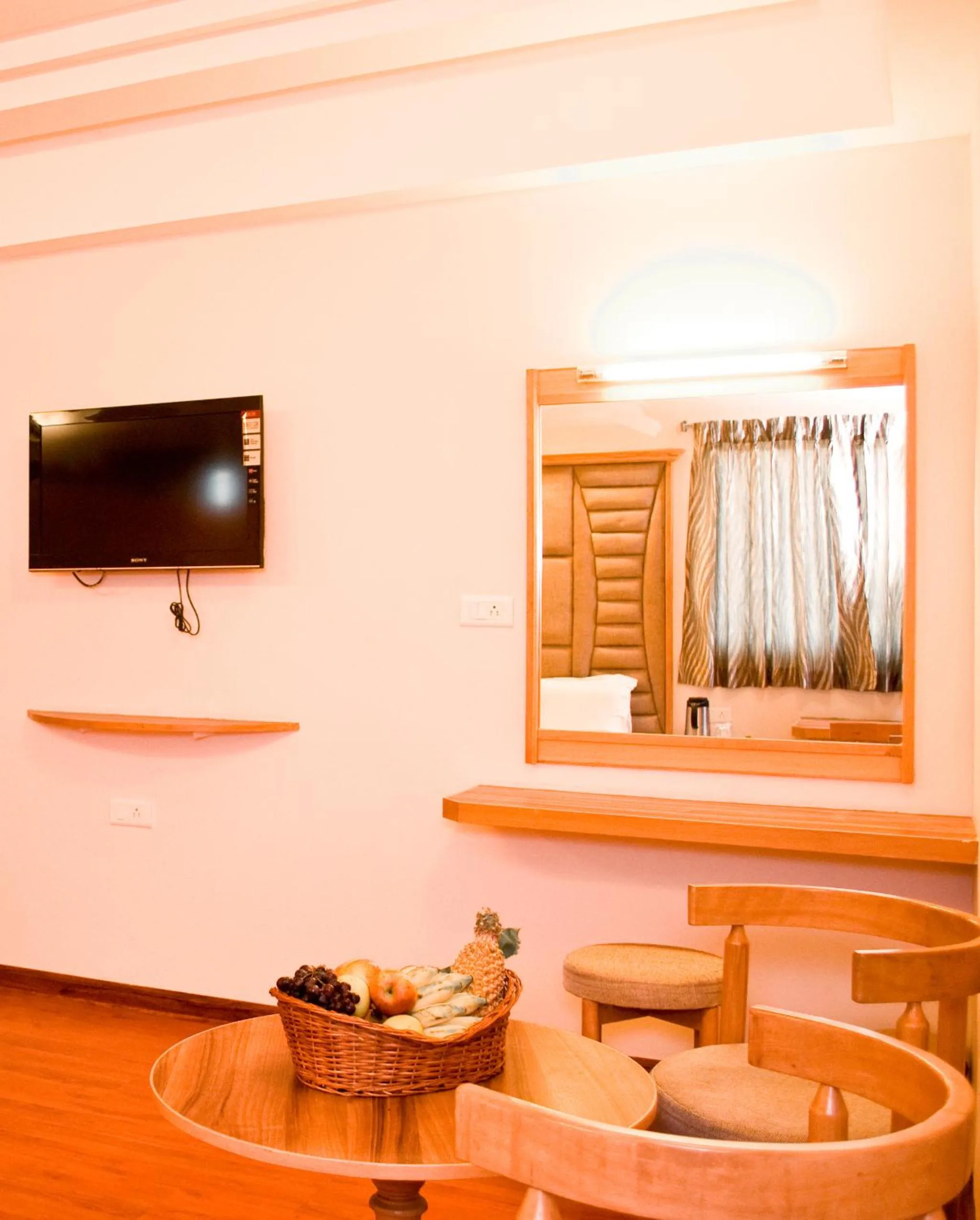 Bed, TV/Entertainment Center in Hotel Rajadhane Madurai