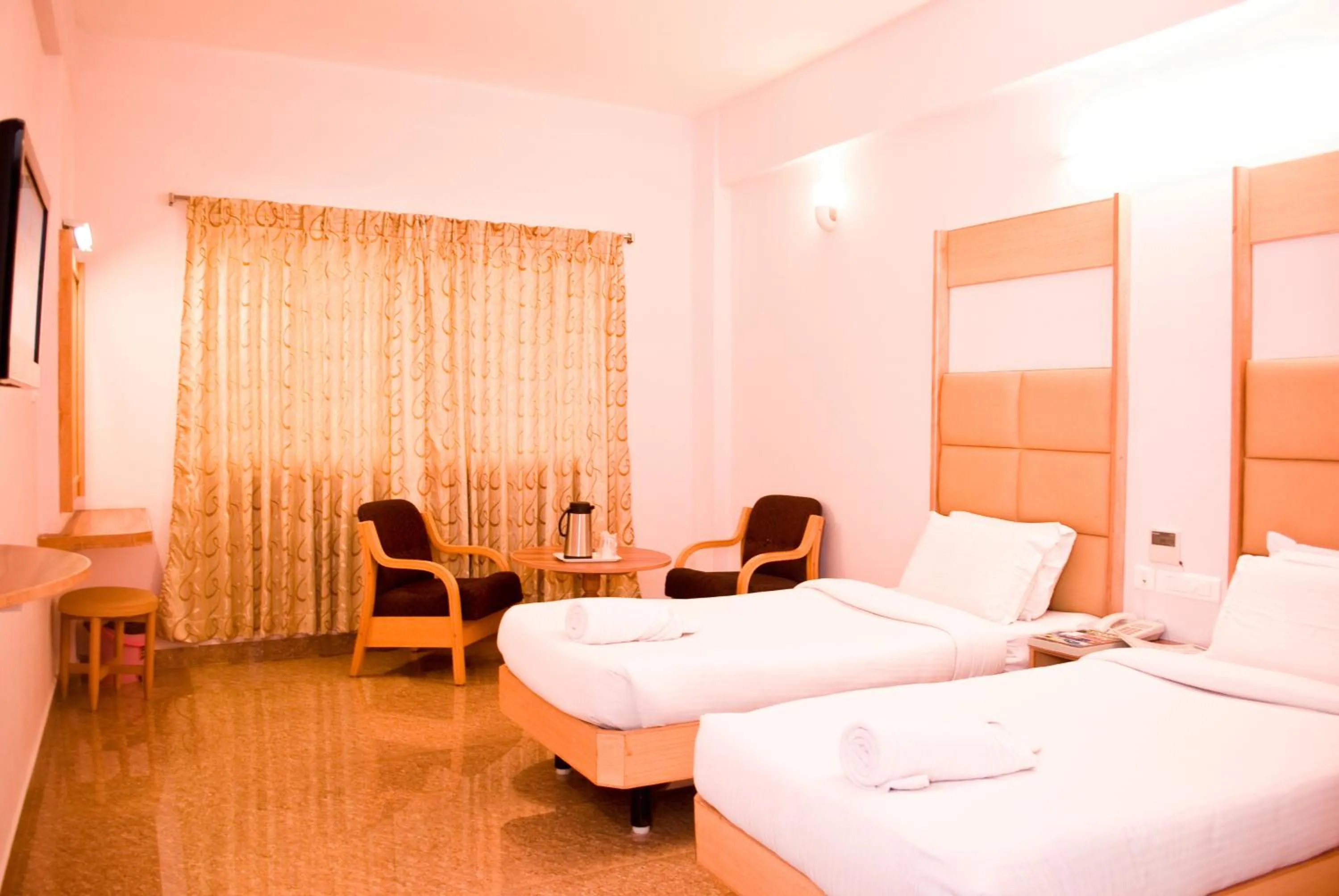 Bed in Hotel Rajadhane Madurai