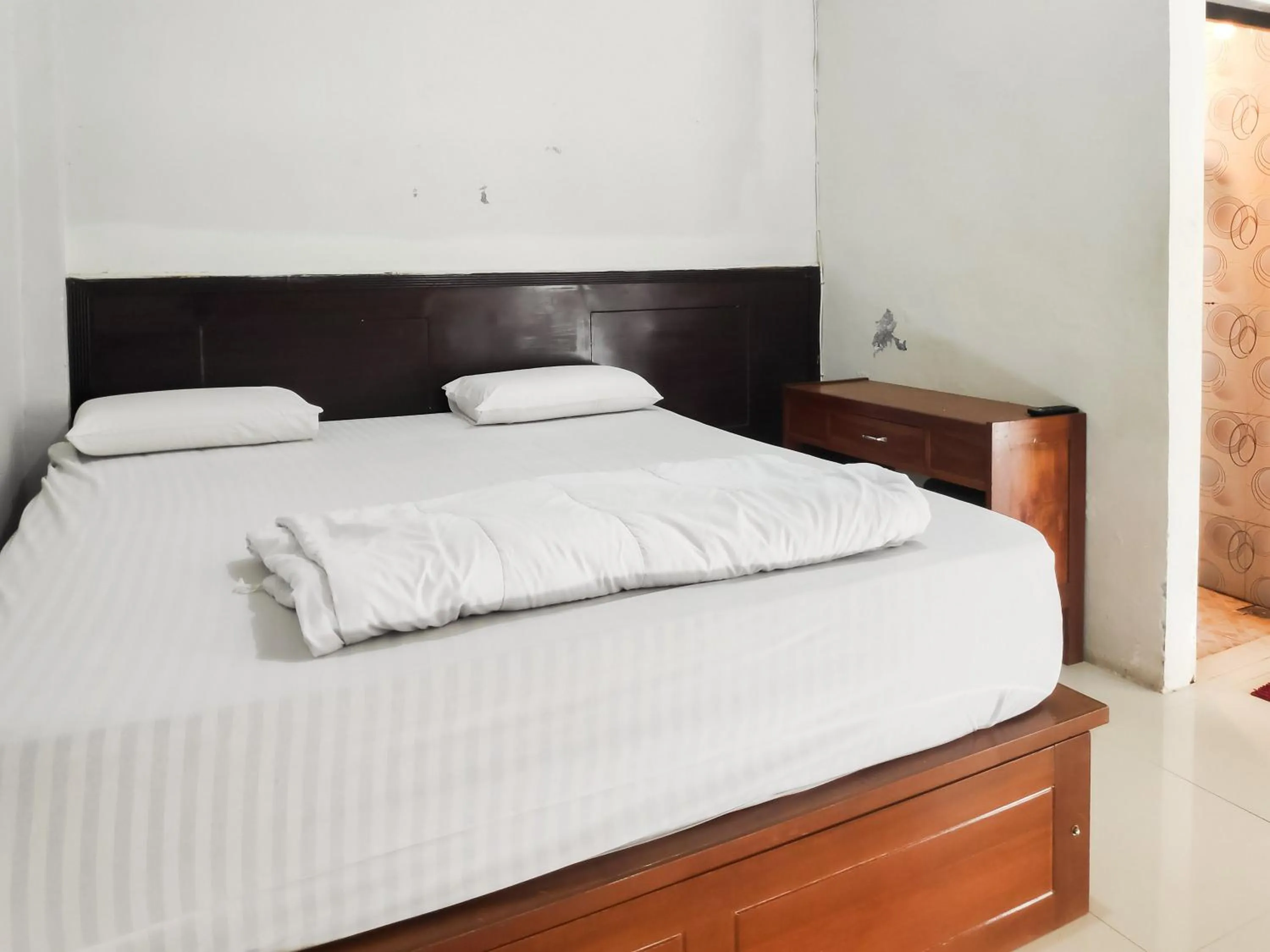 Bed in RedDoorz Syariah near Terminal Terpadu Langsa