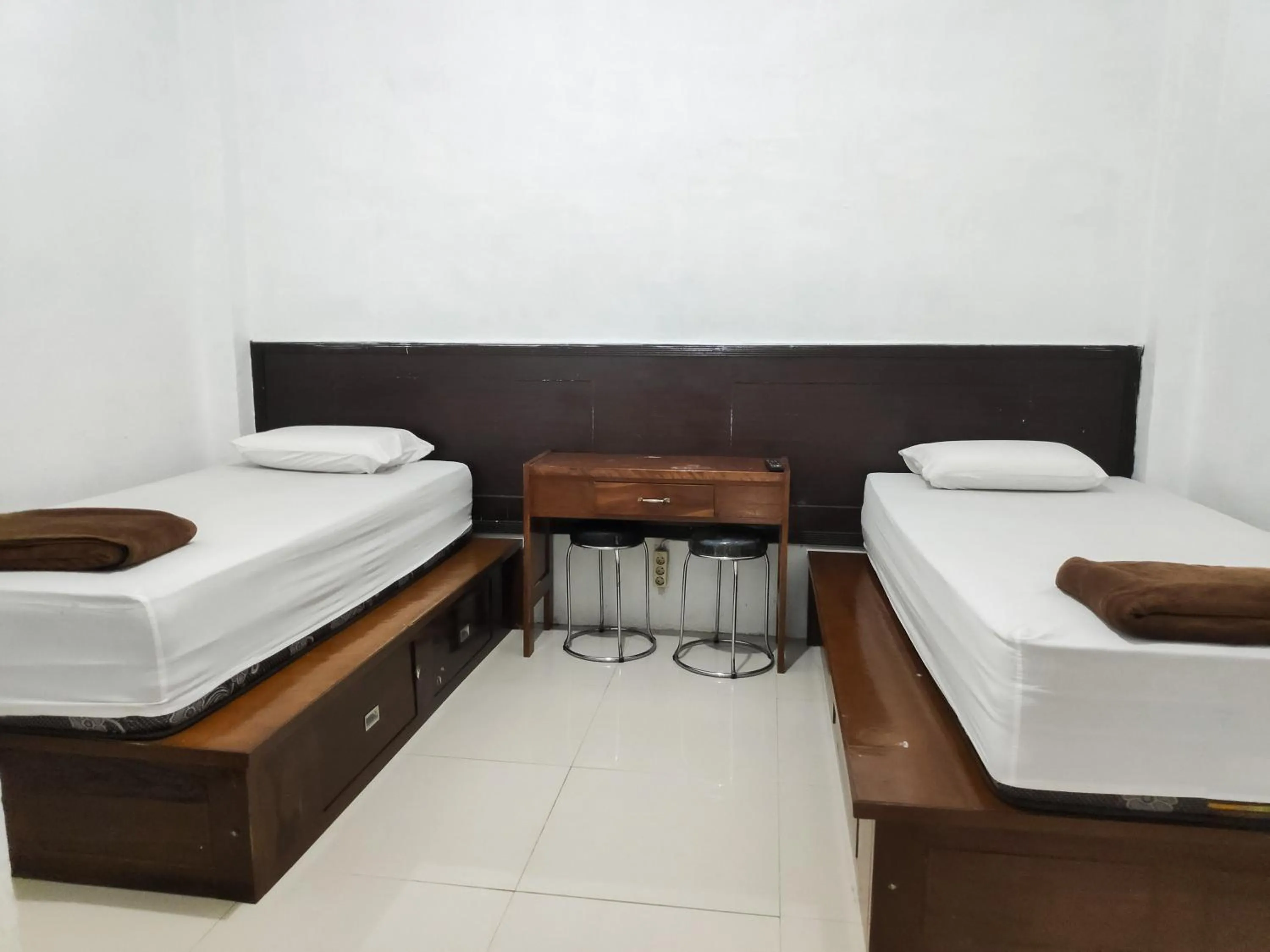 Bed in RedDoorz Syariah near Terminal Terpadu Langsa