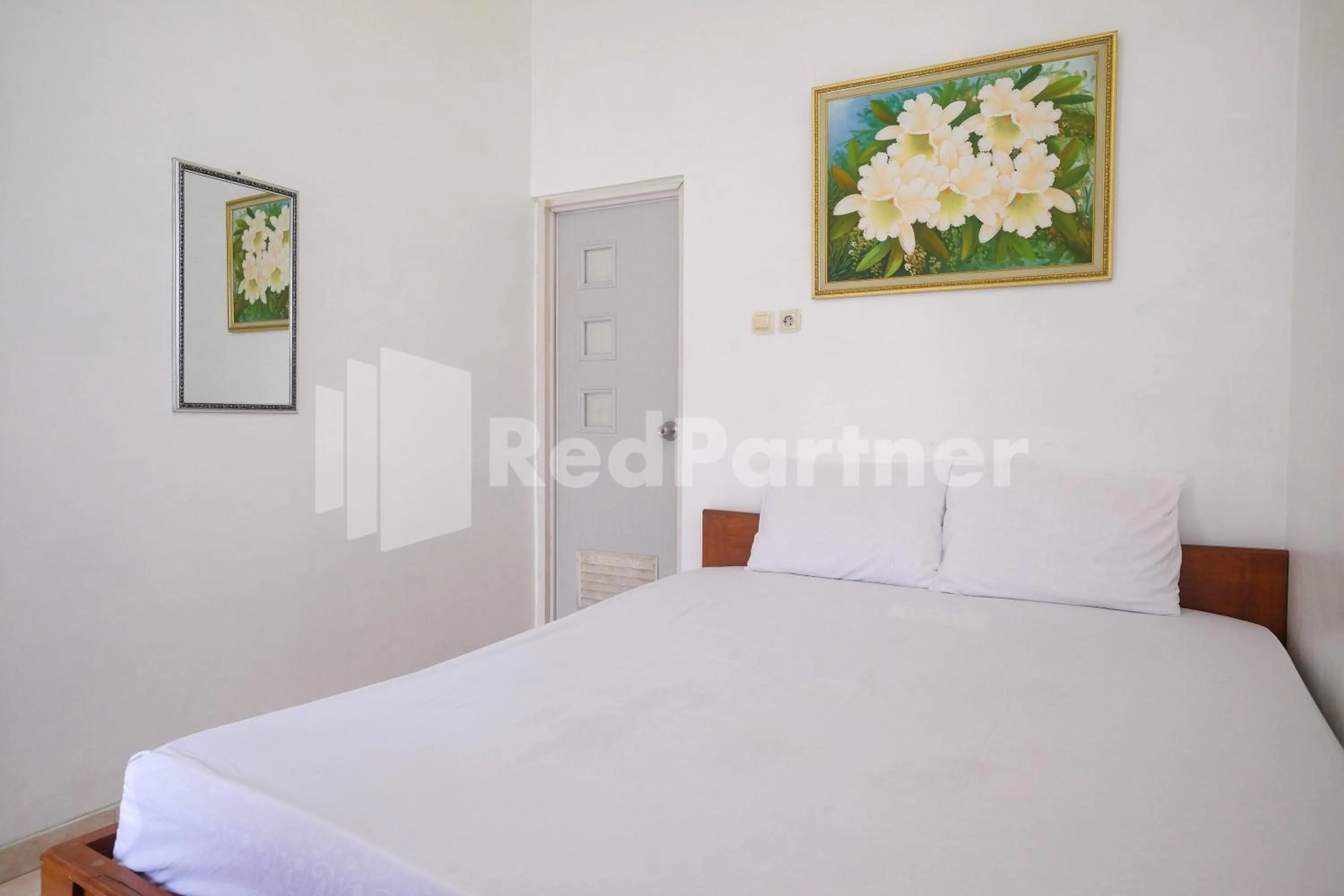 Bed in Wisma Giri Mulyo B near Grojogan Sewu Mitra RedDoorz