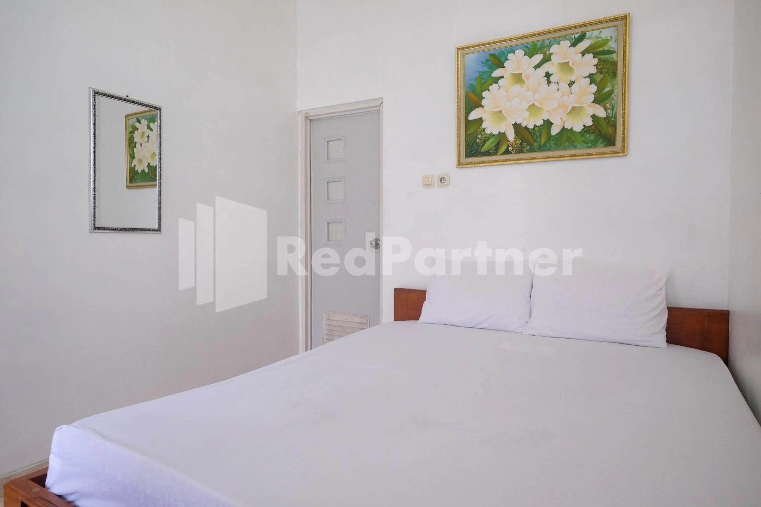 Bed in Wisma Giri Mulyo B near Grojogan Sewu Mitra RedDoorz